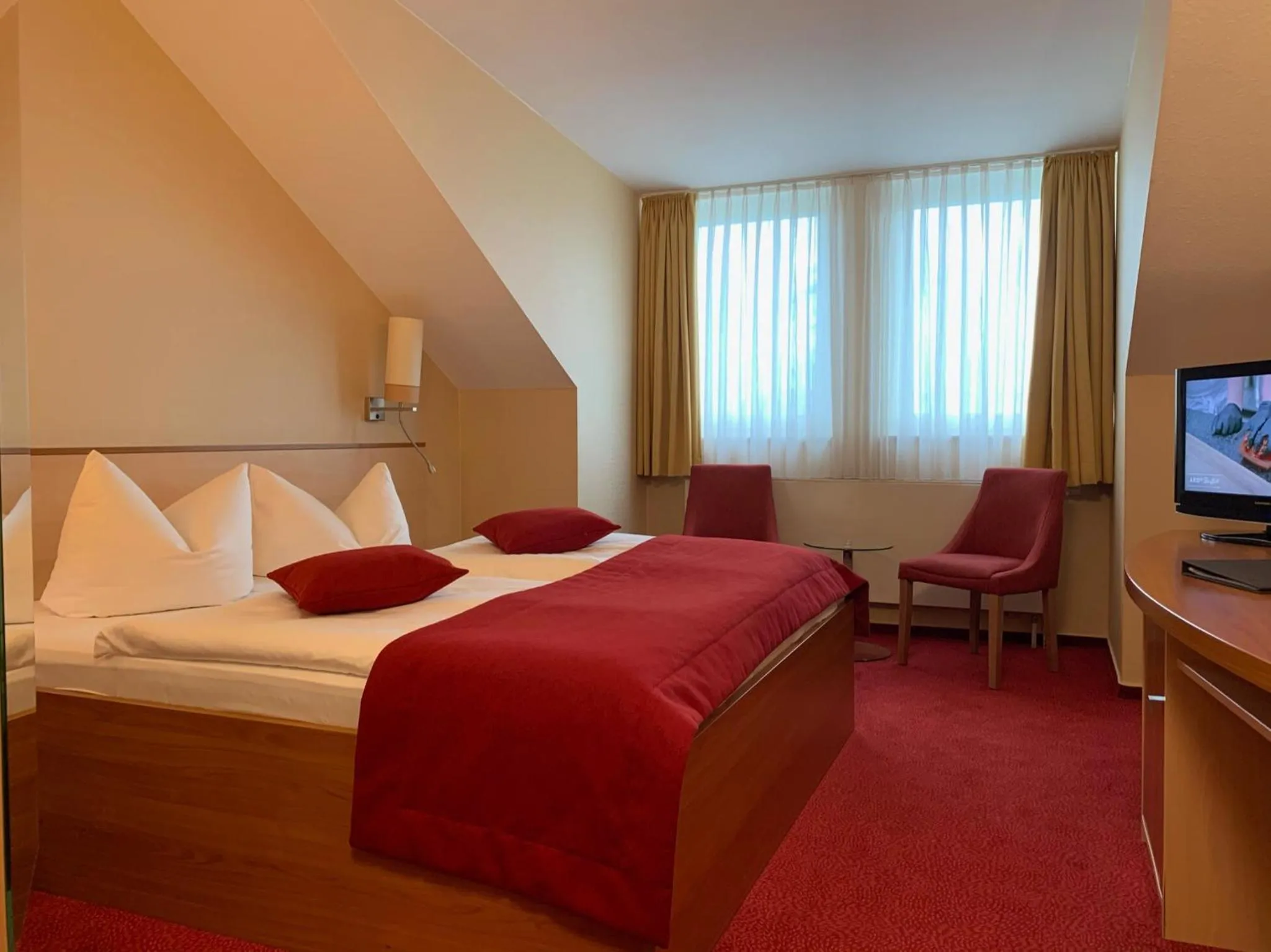Photo of the whole room, Bed in Atrium Hotel Krüger
