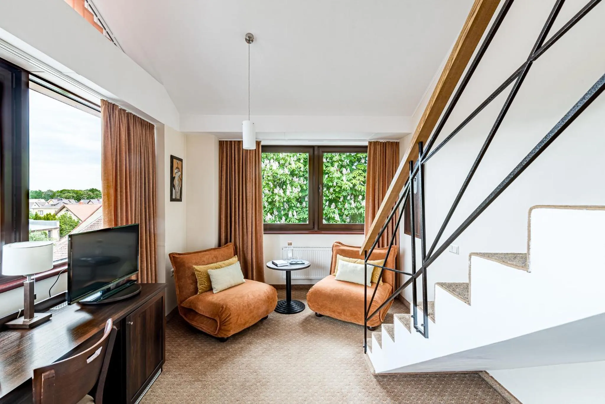 Communal lounge/ TV room in Kerpė Hotel & SPA