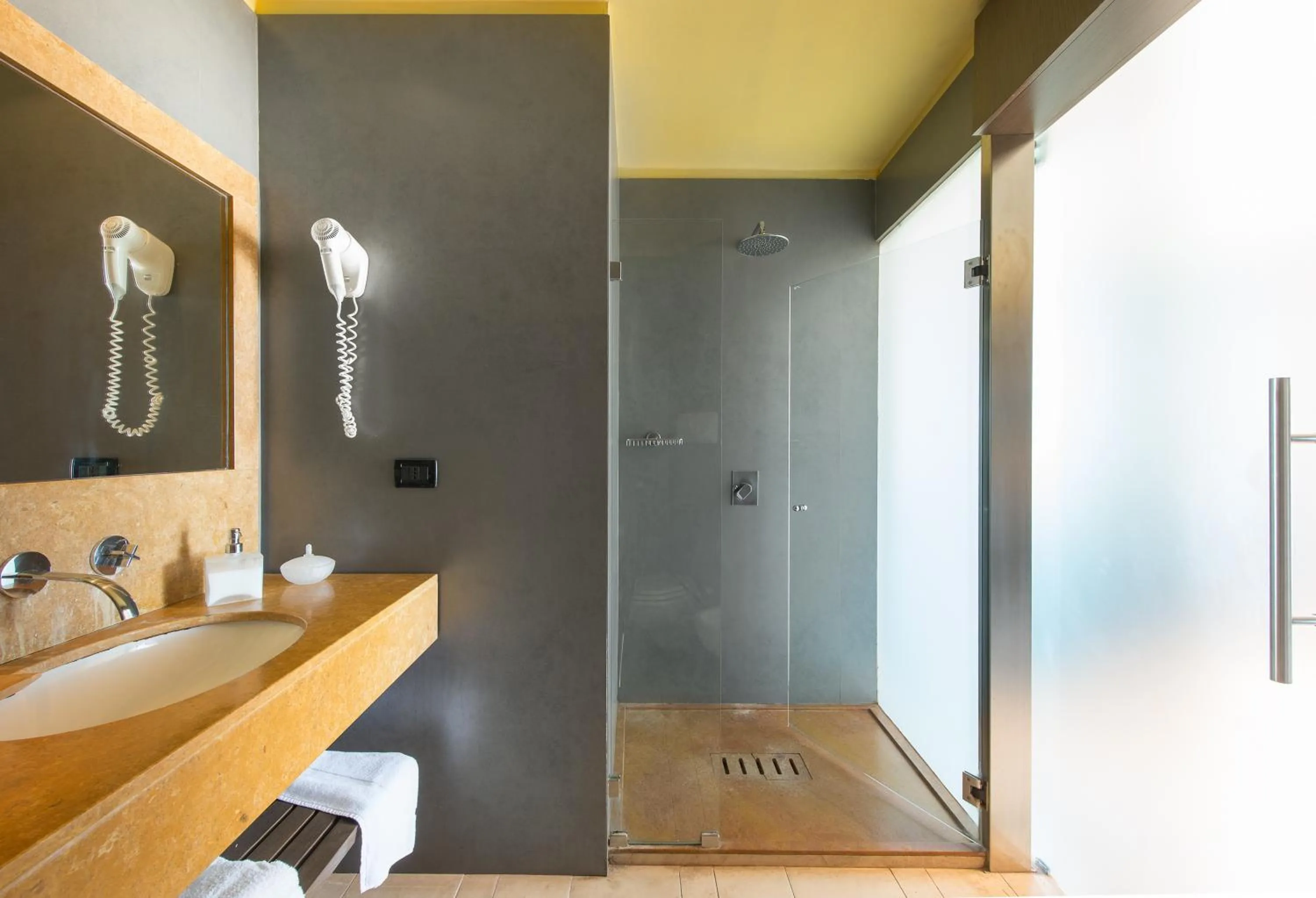 Bathroom in Hotel Capo San Vito by Geocharme