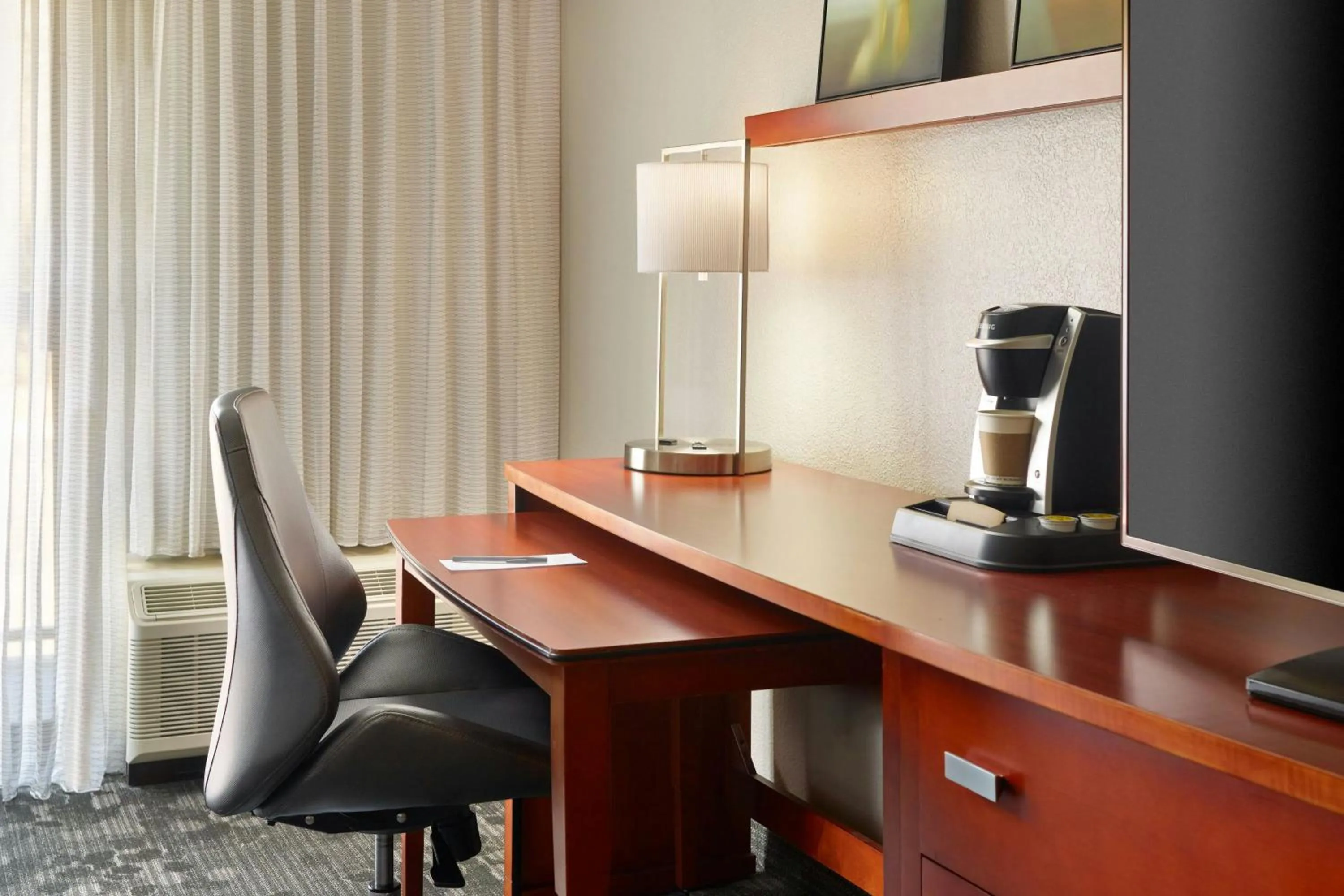 Photo of the whole room in Courtyard by Marriott Atlanta Airport South/Sullivan Road