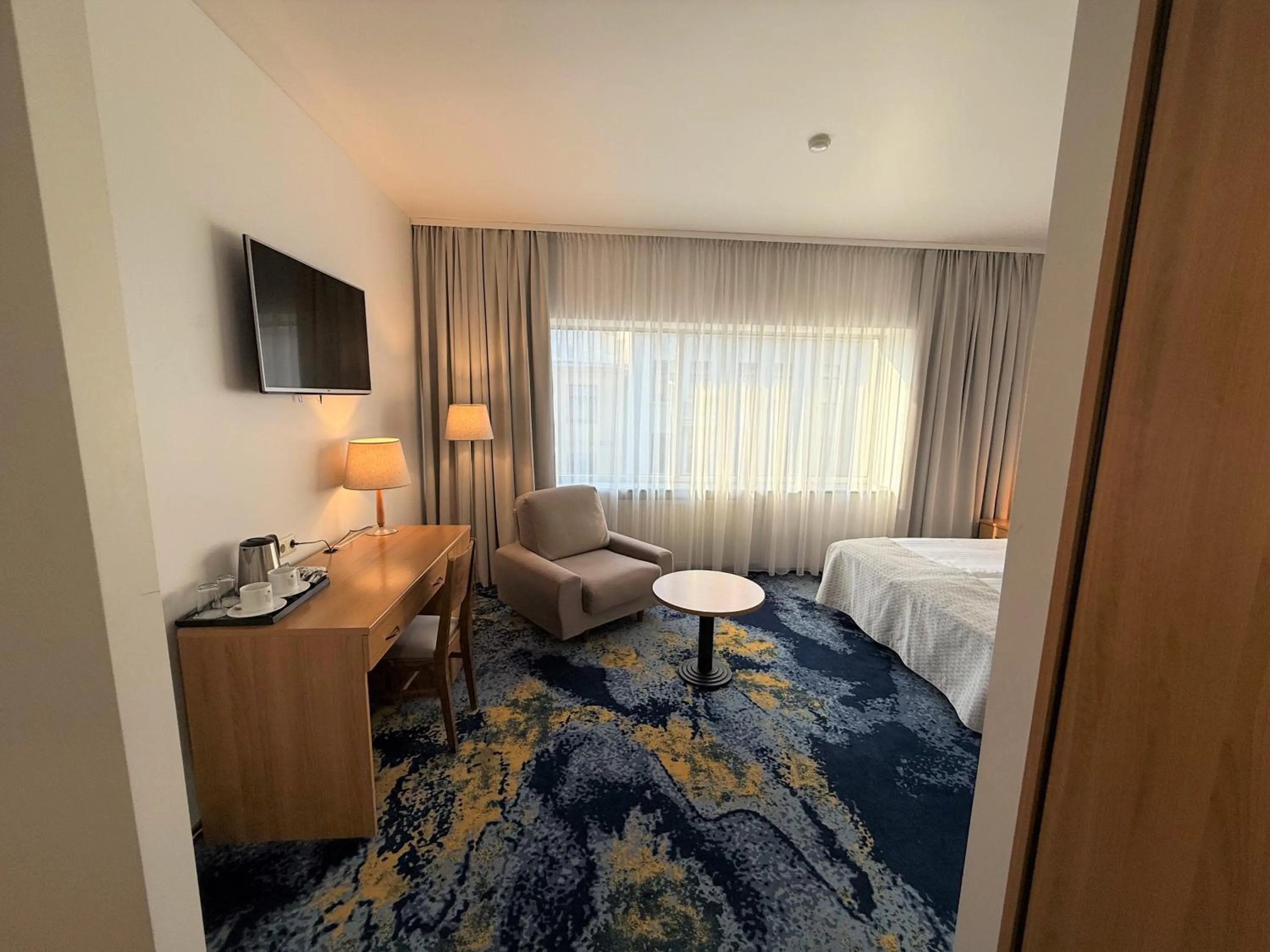 Coffee/tea facilities, Bed in BEST BALTIC Kaunas