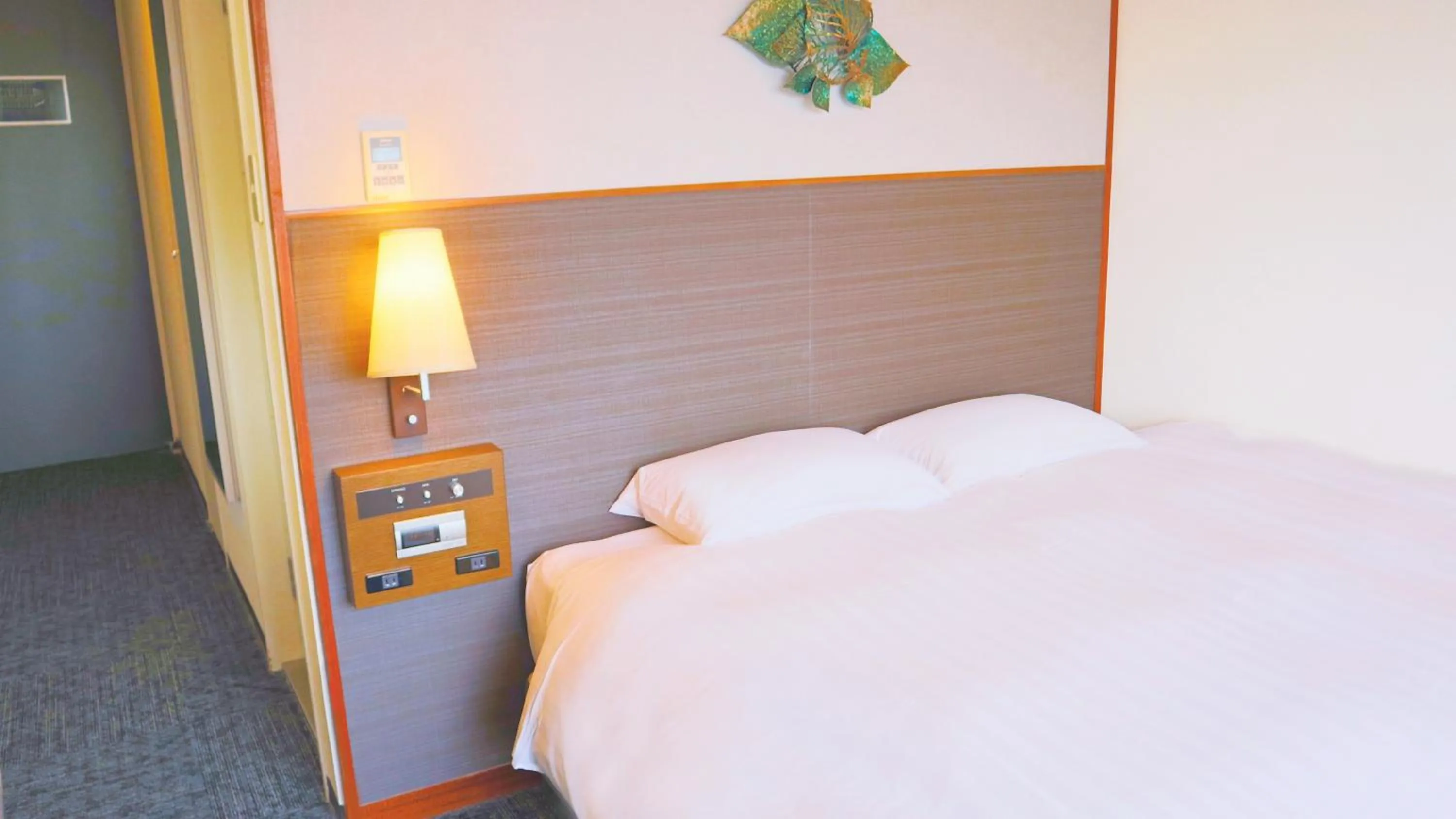 Bed in Premier Hotel Nakajima Park Sapporo