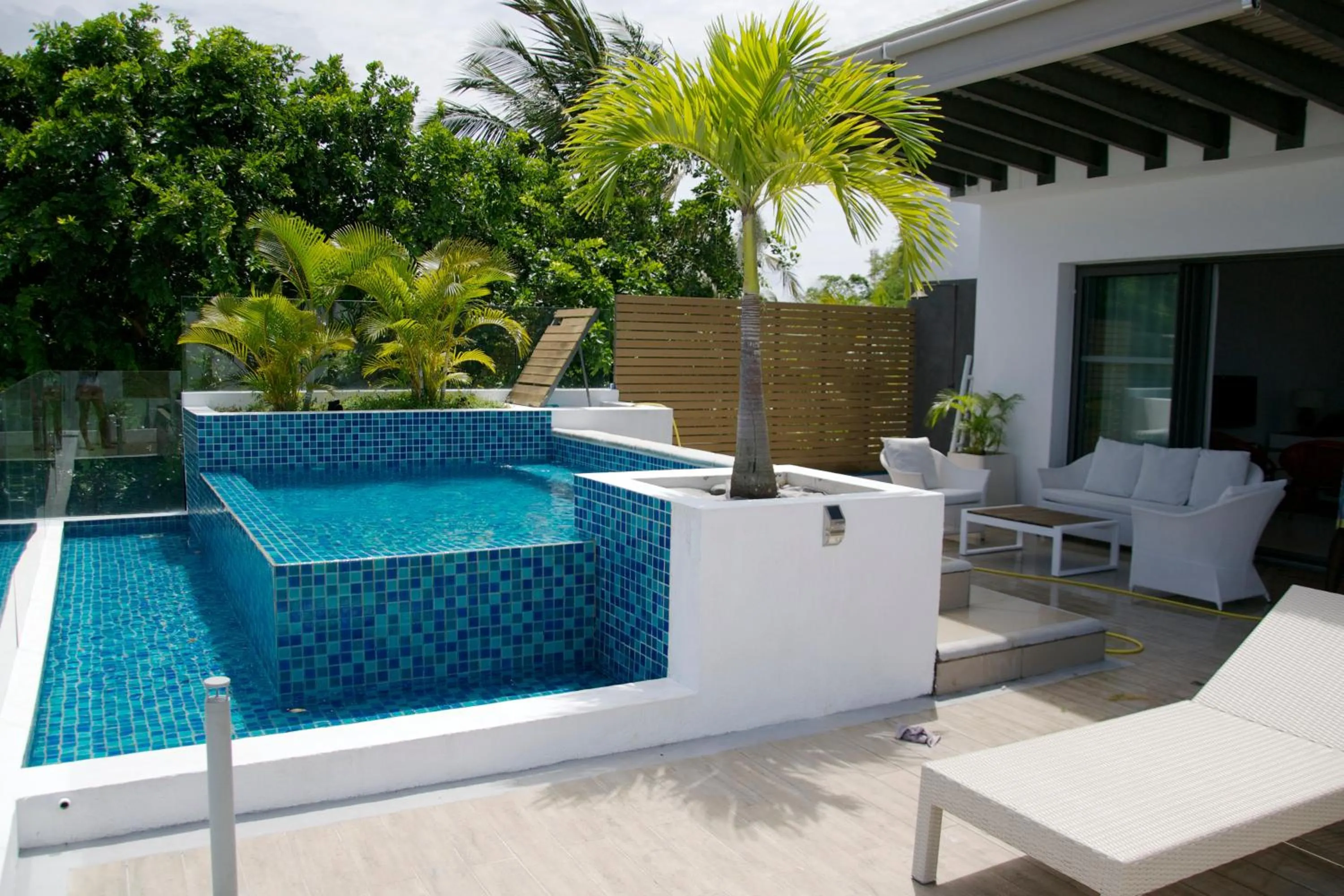 Swimming pool in Cap Ouest Beachfront Luxury Penthouse & Apartment