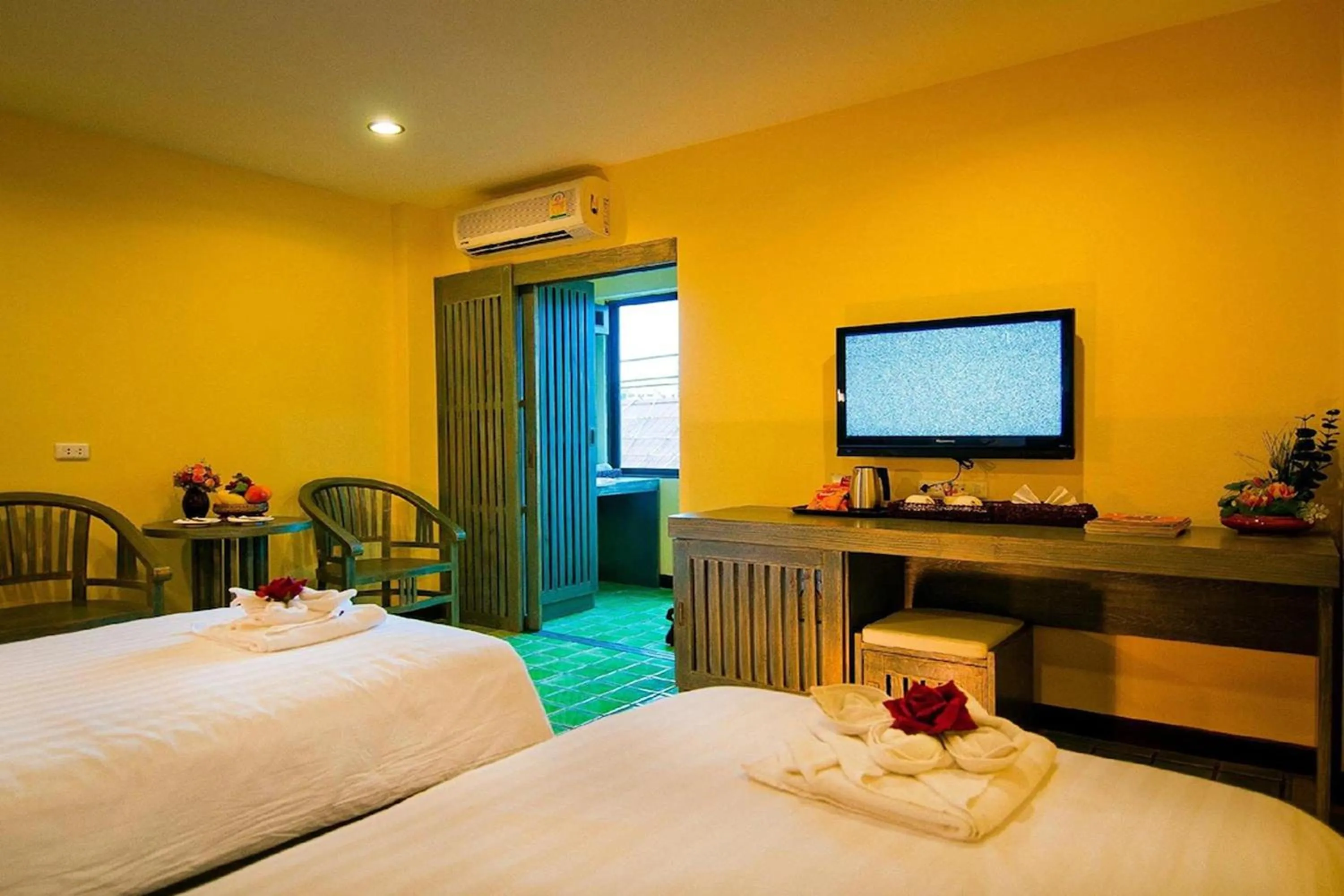 Bed in CM Night Bazaar Boutique Hotel - โรงแรม ซี เอ็ม ไนท์บาซาร์ บูทีค