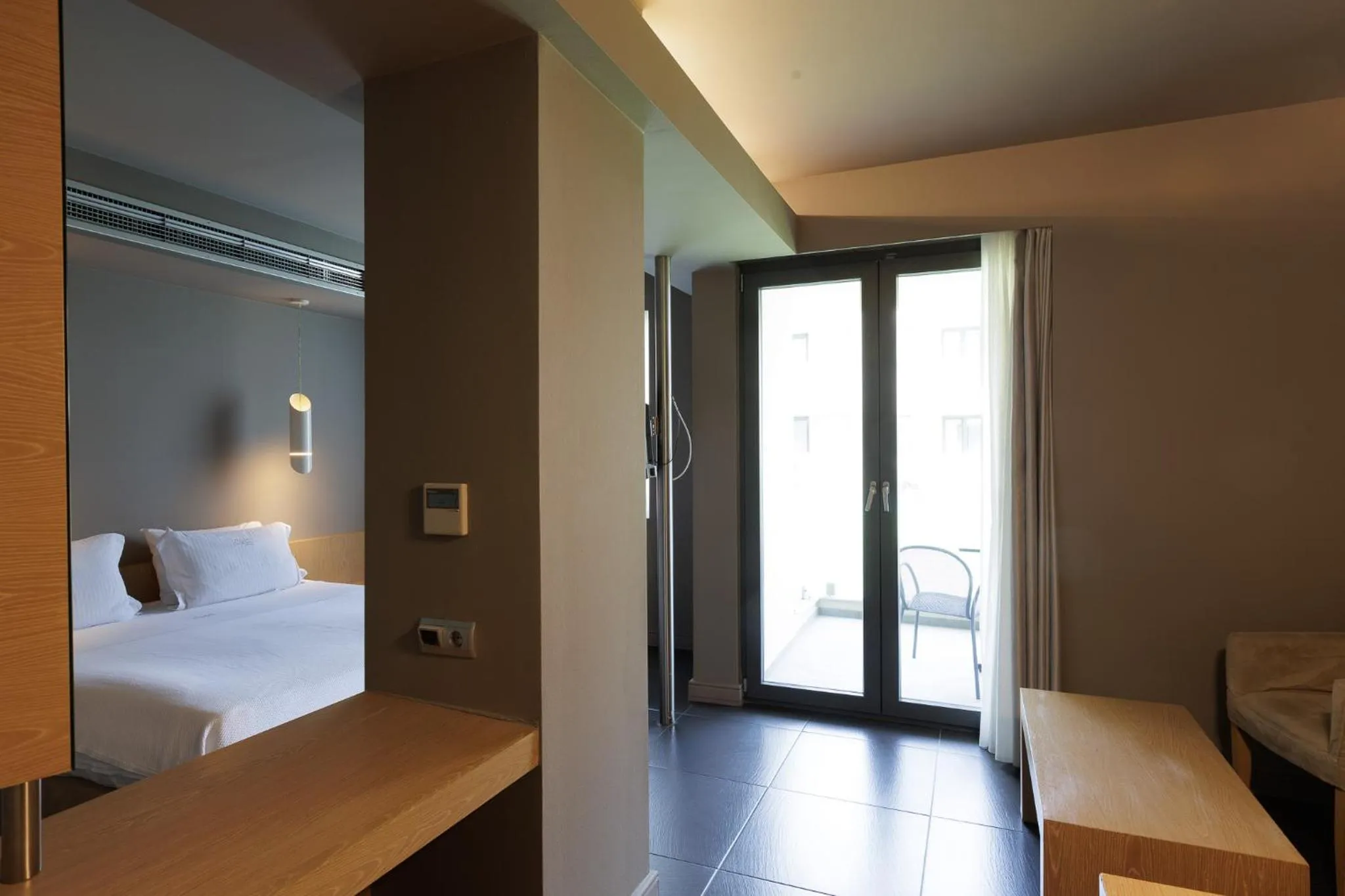 Bed in Elysion Hotel