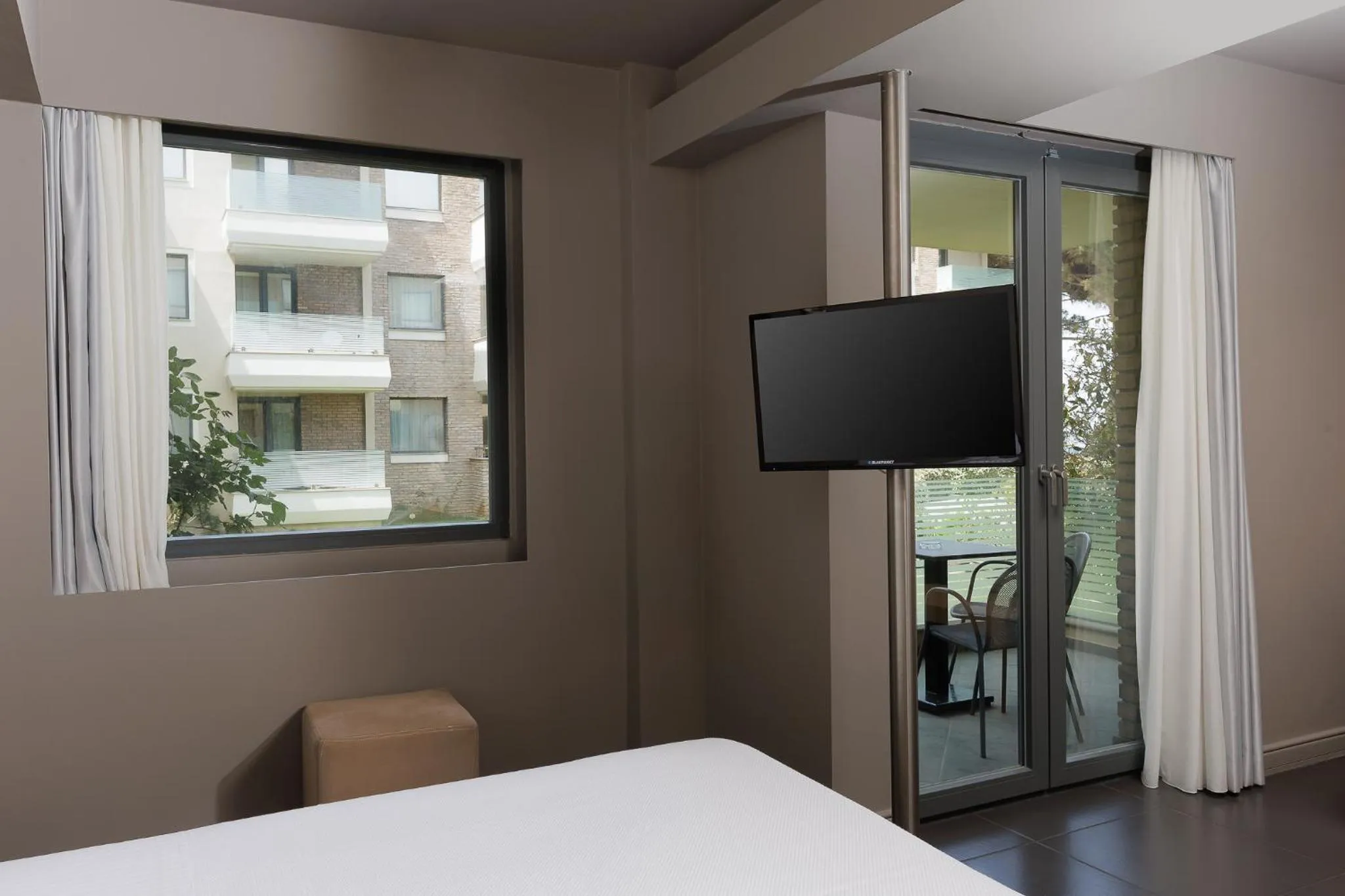 Bed in Elysion Hotel