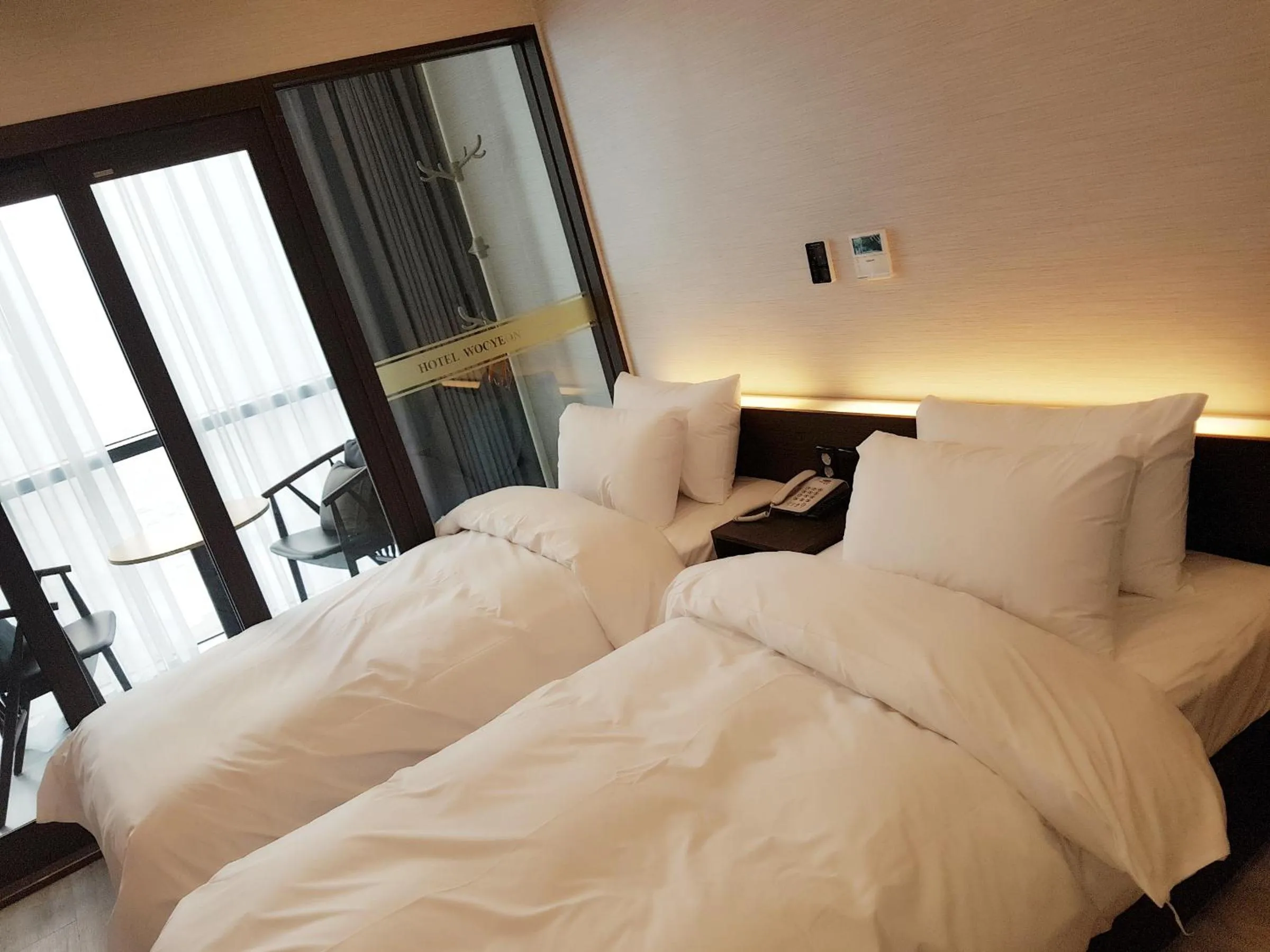 Bed in Hotel Wooyeon Flora