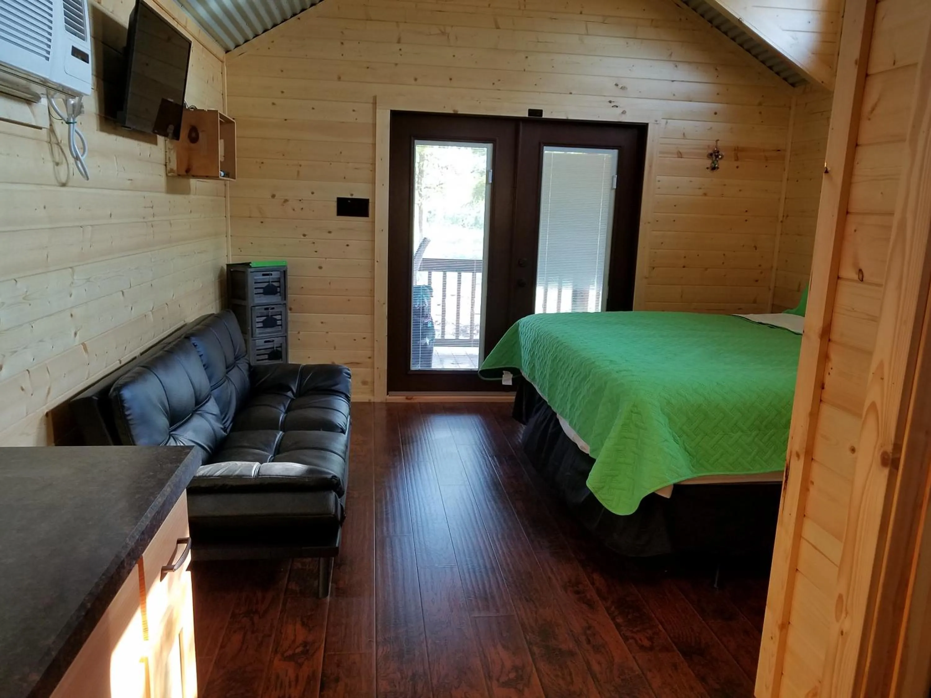 Photo of the whole room, Bed in Al's Hideaway Cabin and RV Space, LLC