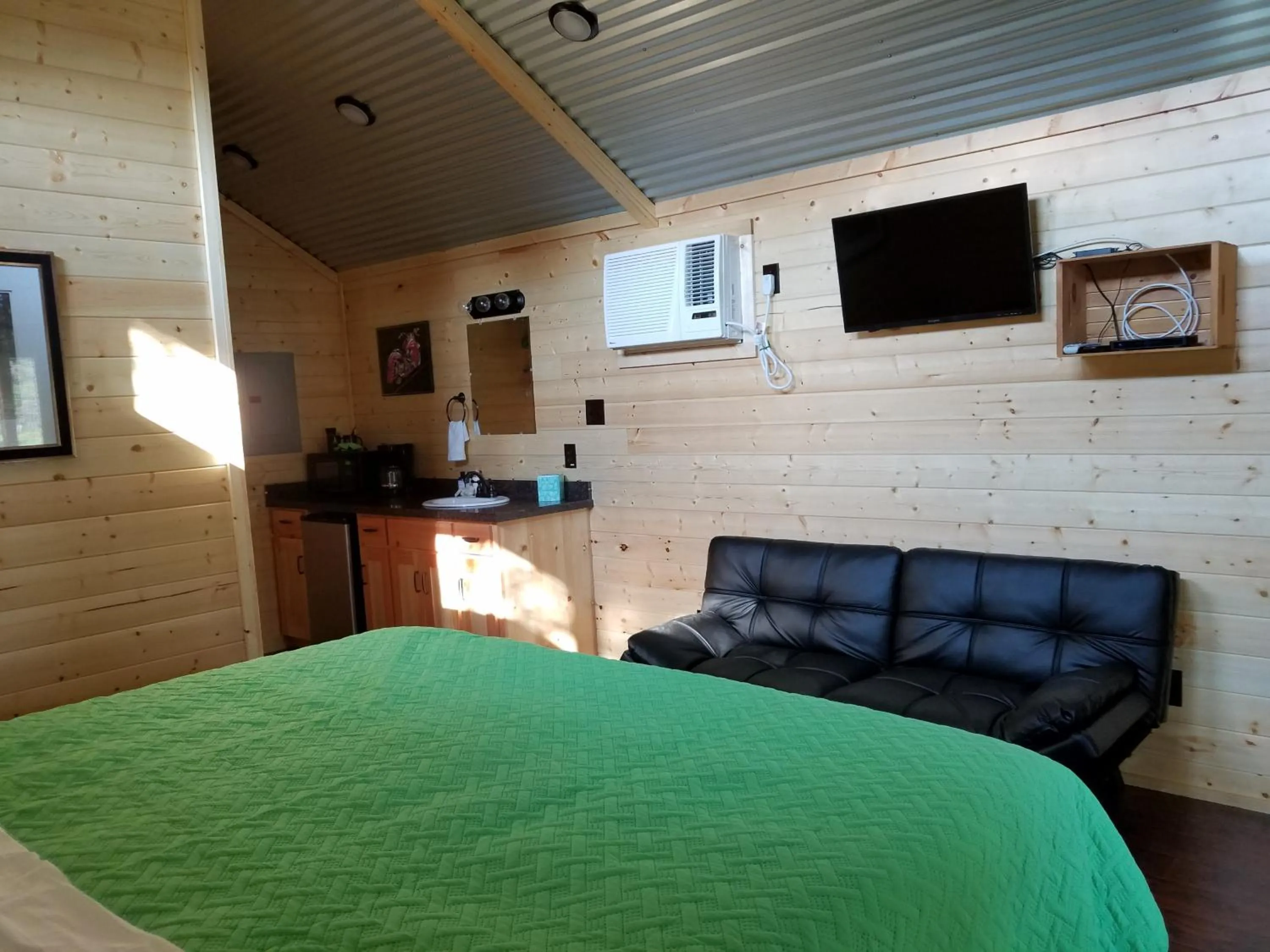 TV and multimedia, Bed in Al's Hideaway Cabin and RV Space, LLC