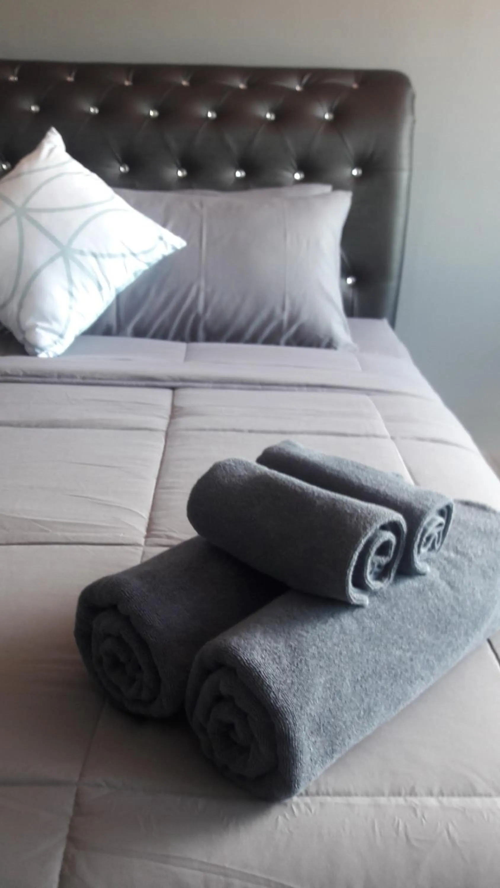 Bed in Asia's Beach Apartments