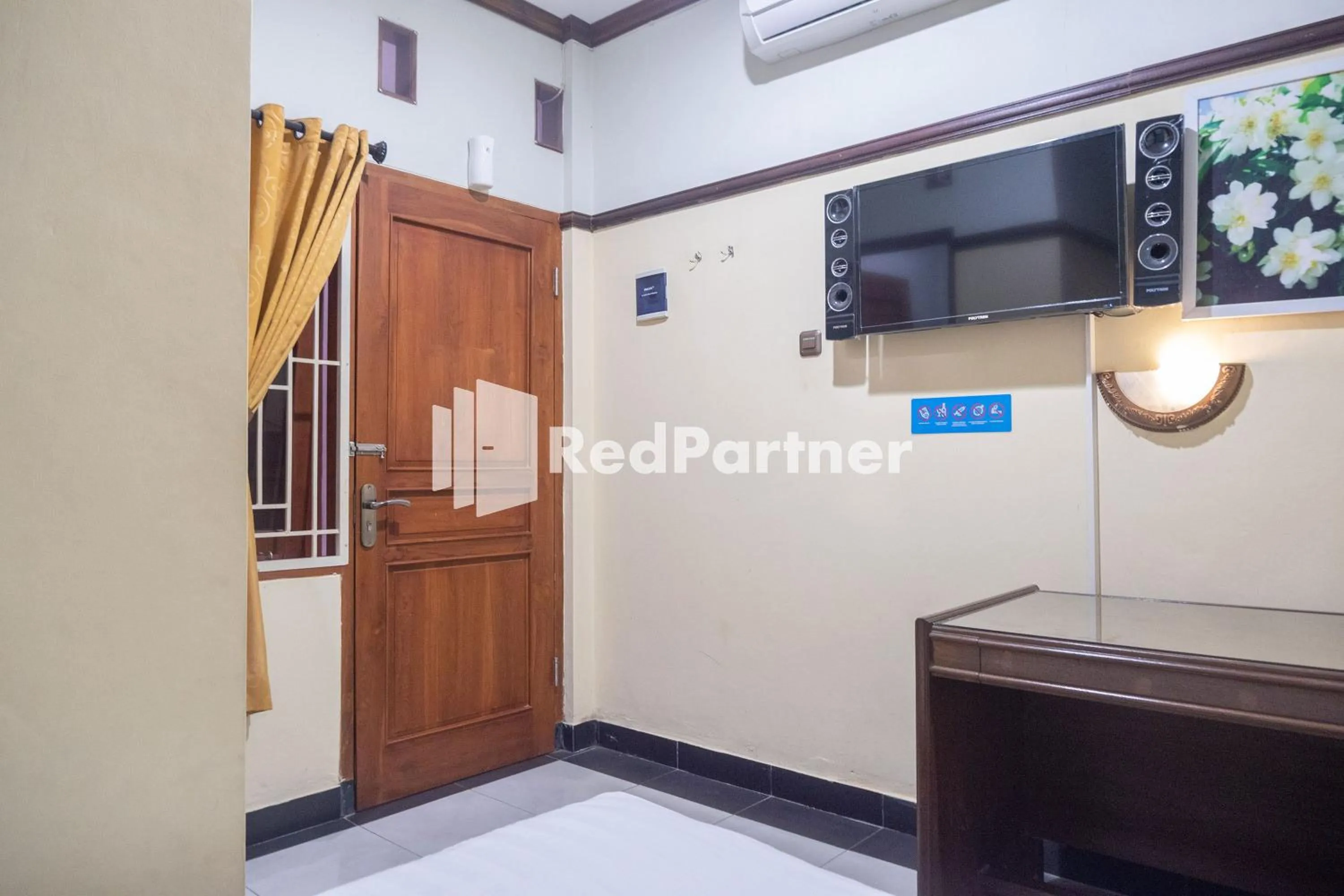 TV and multimedia in Athaya Hotel Syariah near UGM Yogyakarta Mitra RedDoorz