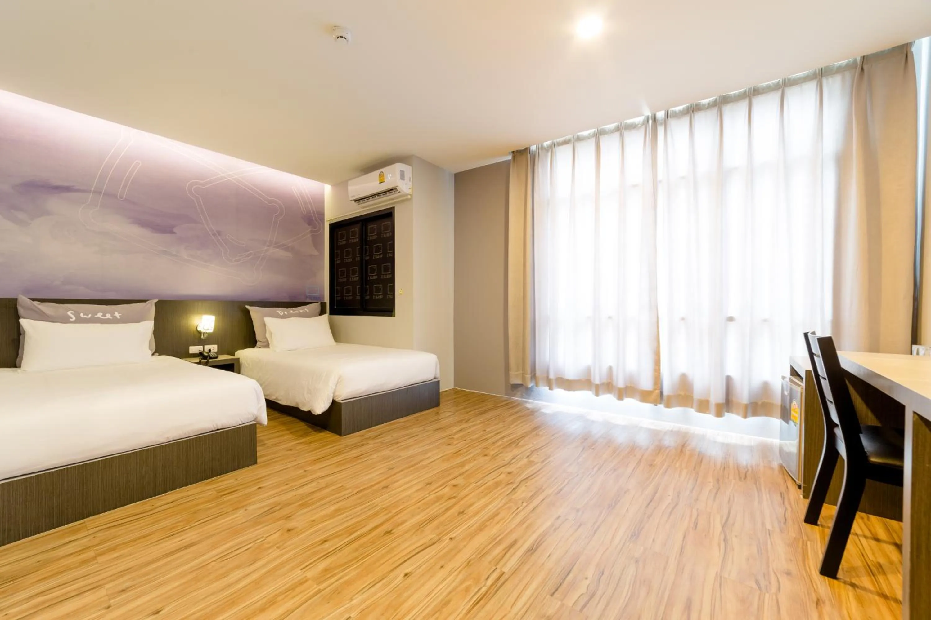 Bed in Z Sleep Hotel