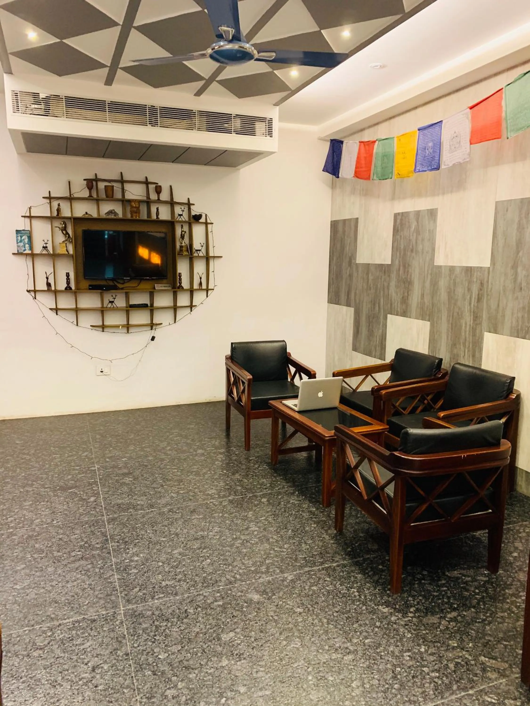 Communal lounge/ TV room in The Loft Hotel, Siliguri