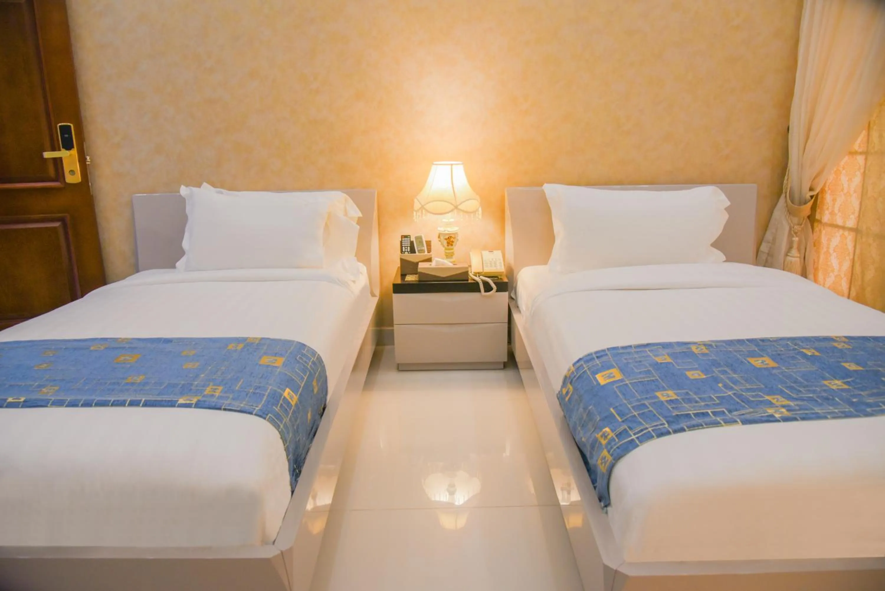 Bed in Orchards Cottage Hotel