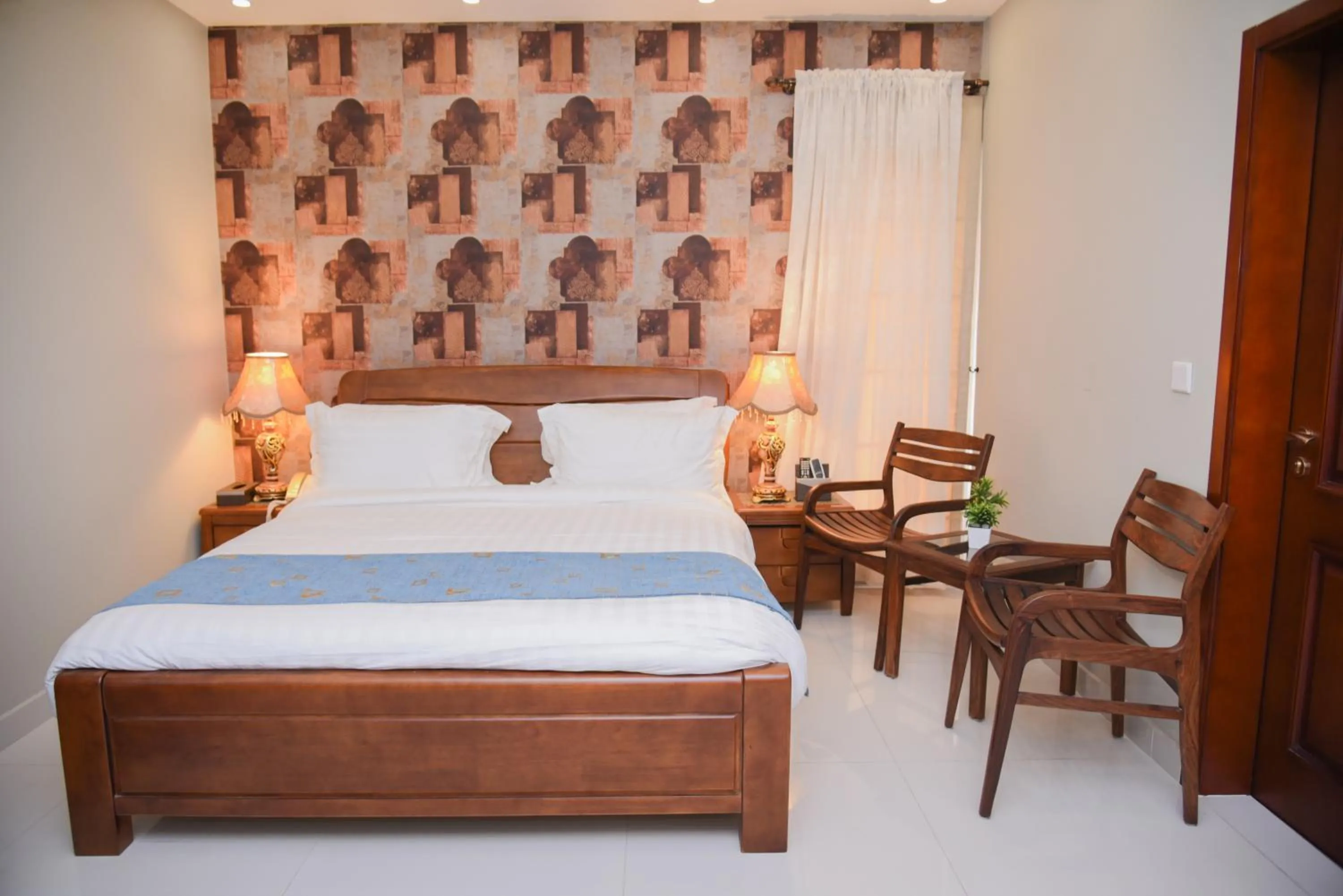 Bed in Orchards Cottage Hotel