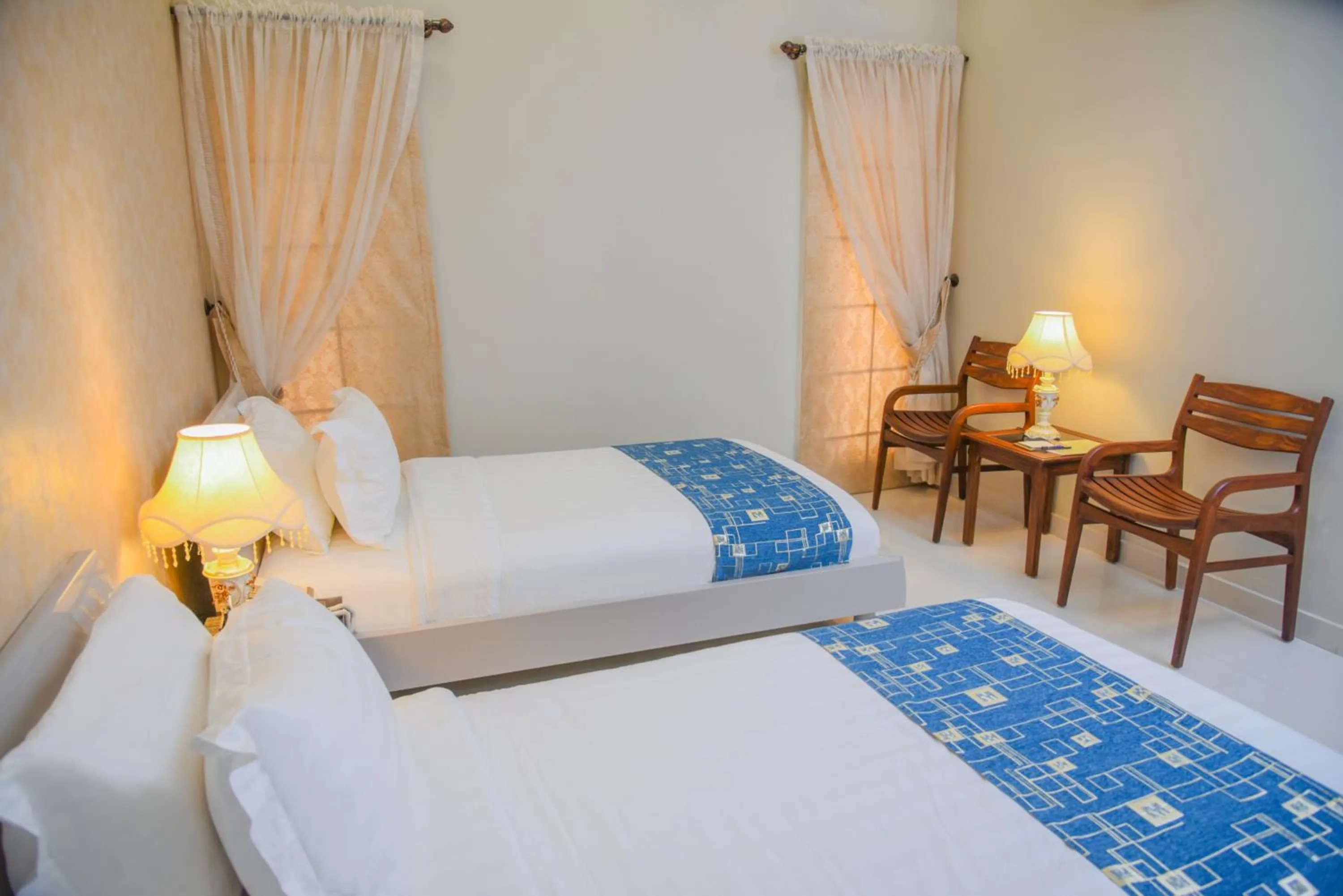 Bed in Orchards Cottage Hotel