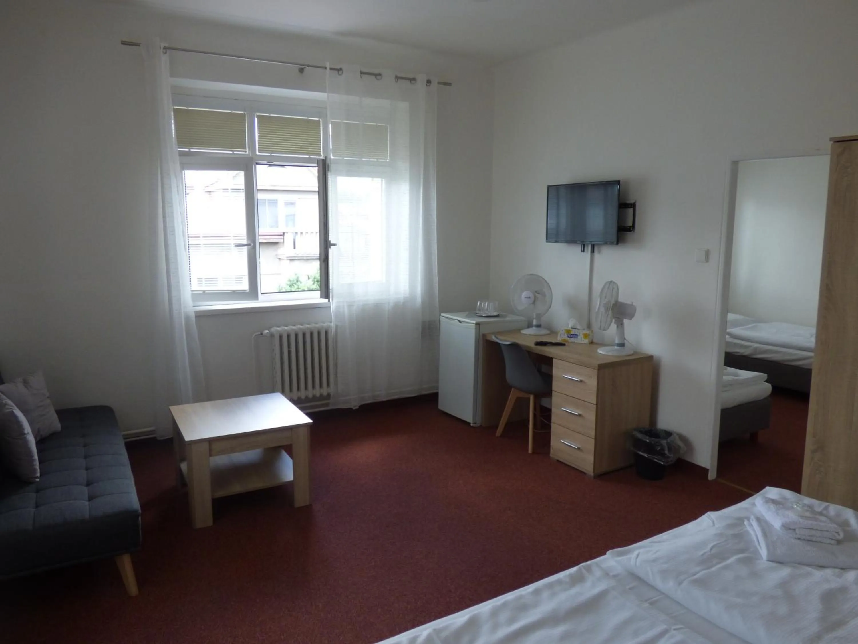 Seating area, Bed in Hotel Svornost