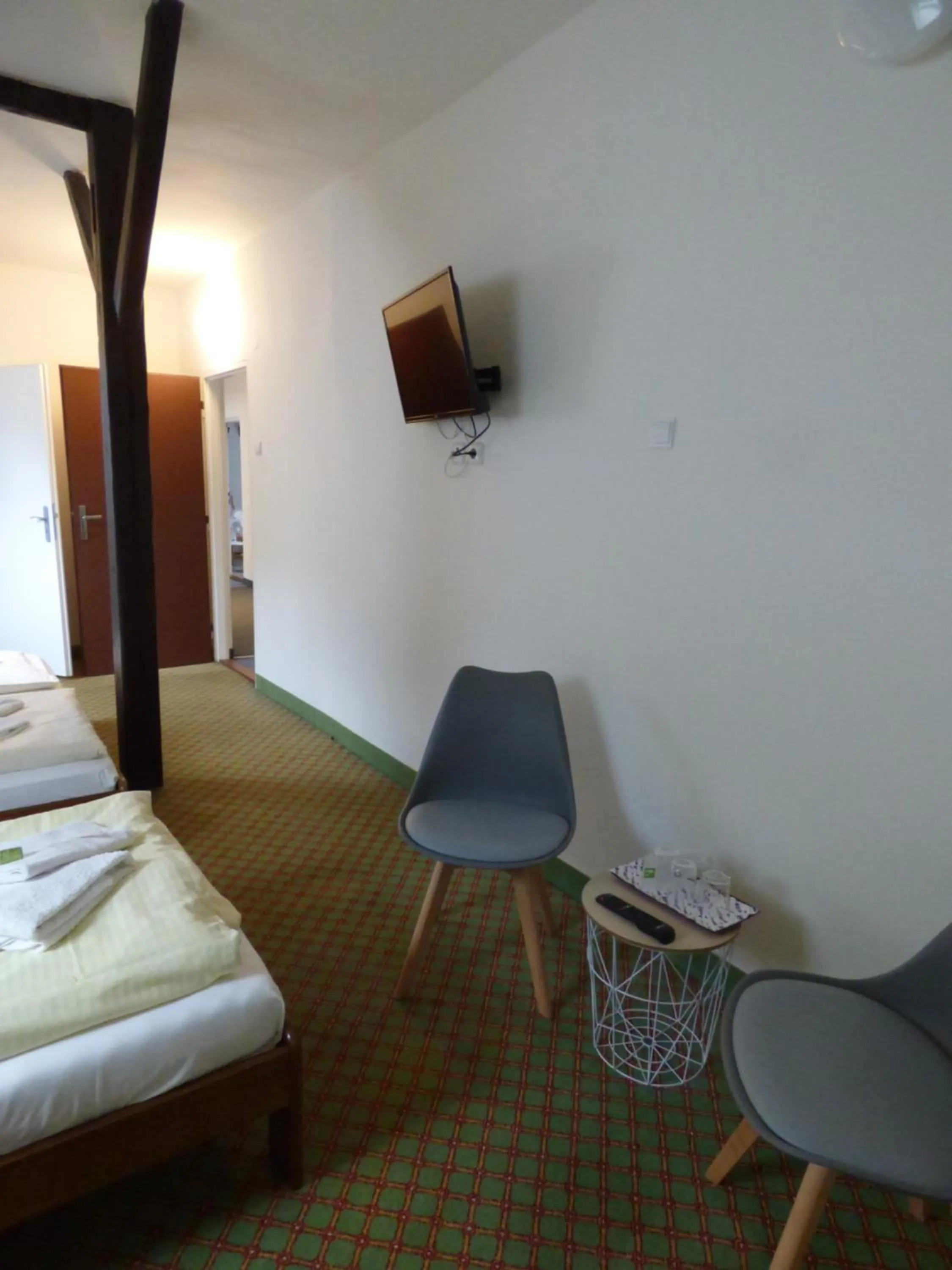 Seating area, Bed in Hotel Svornost