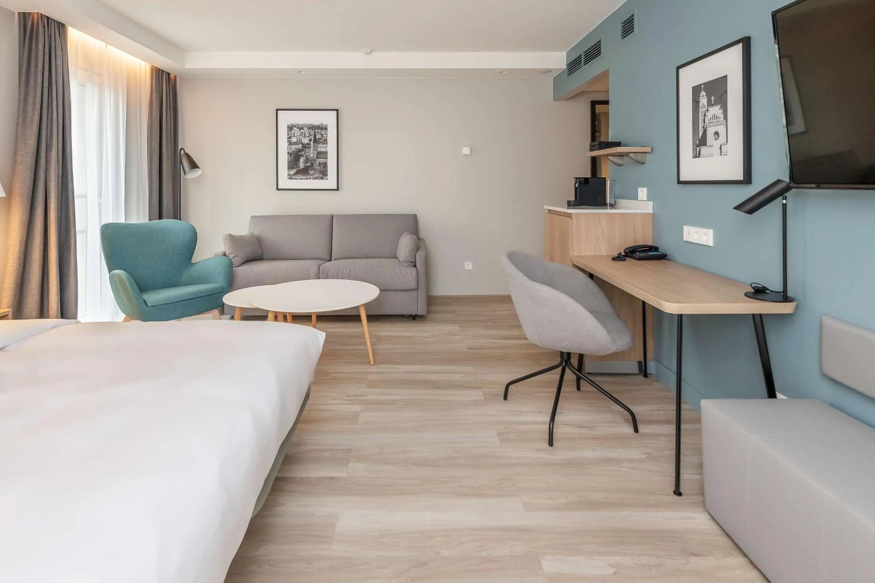 Seating area, Bed in Radisson Hotel Kaunas