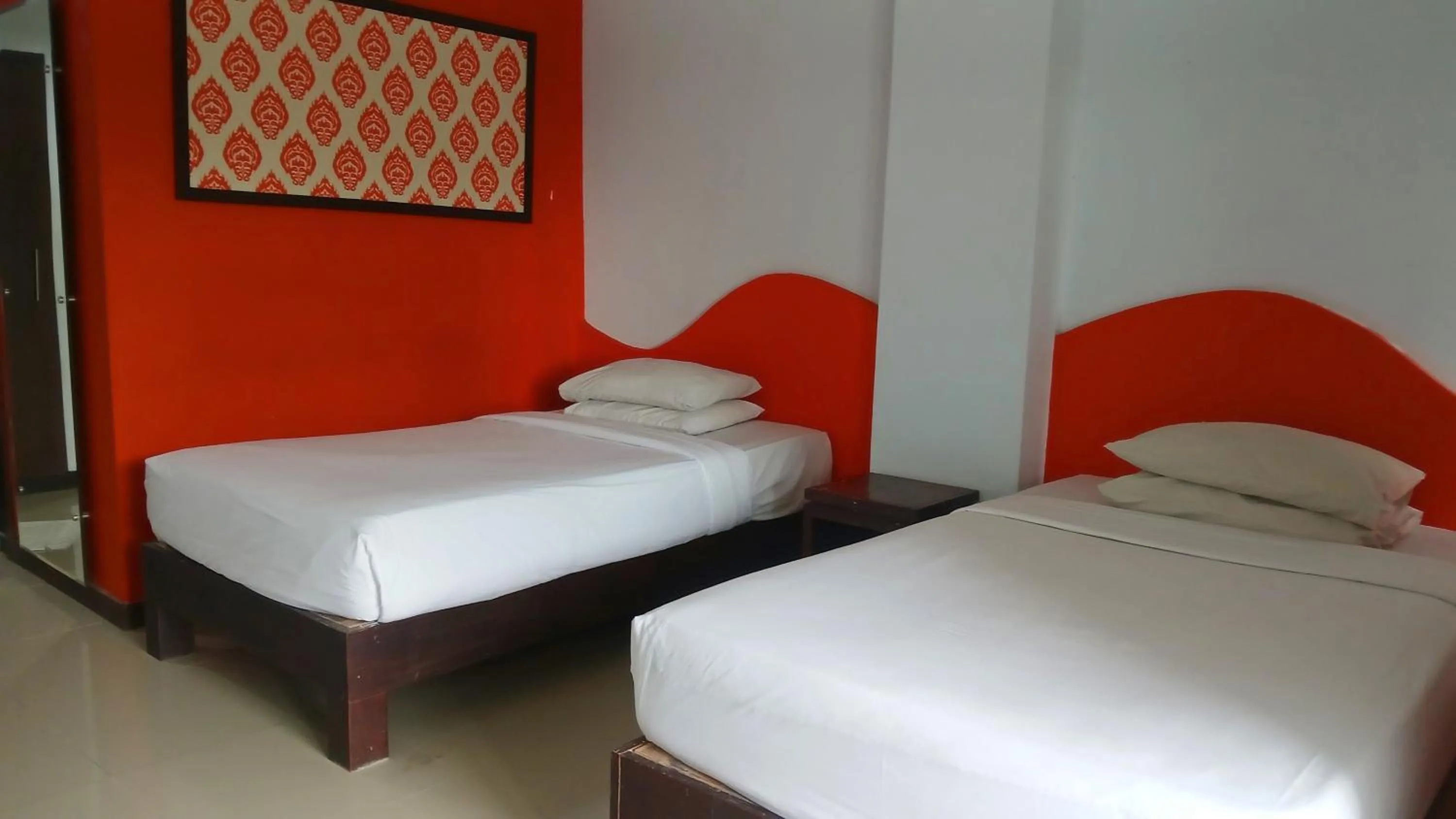 Bedroom, Bed in Nirmala Hotel & Convention Centre