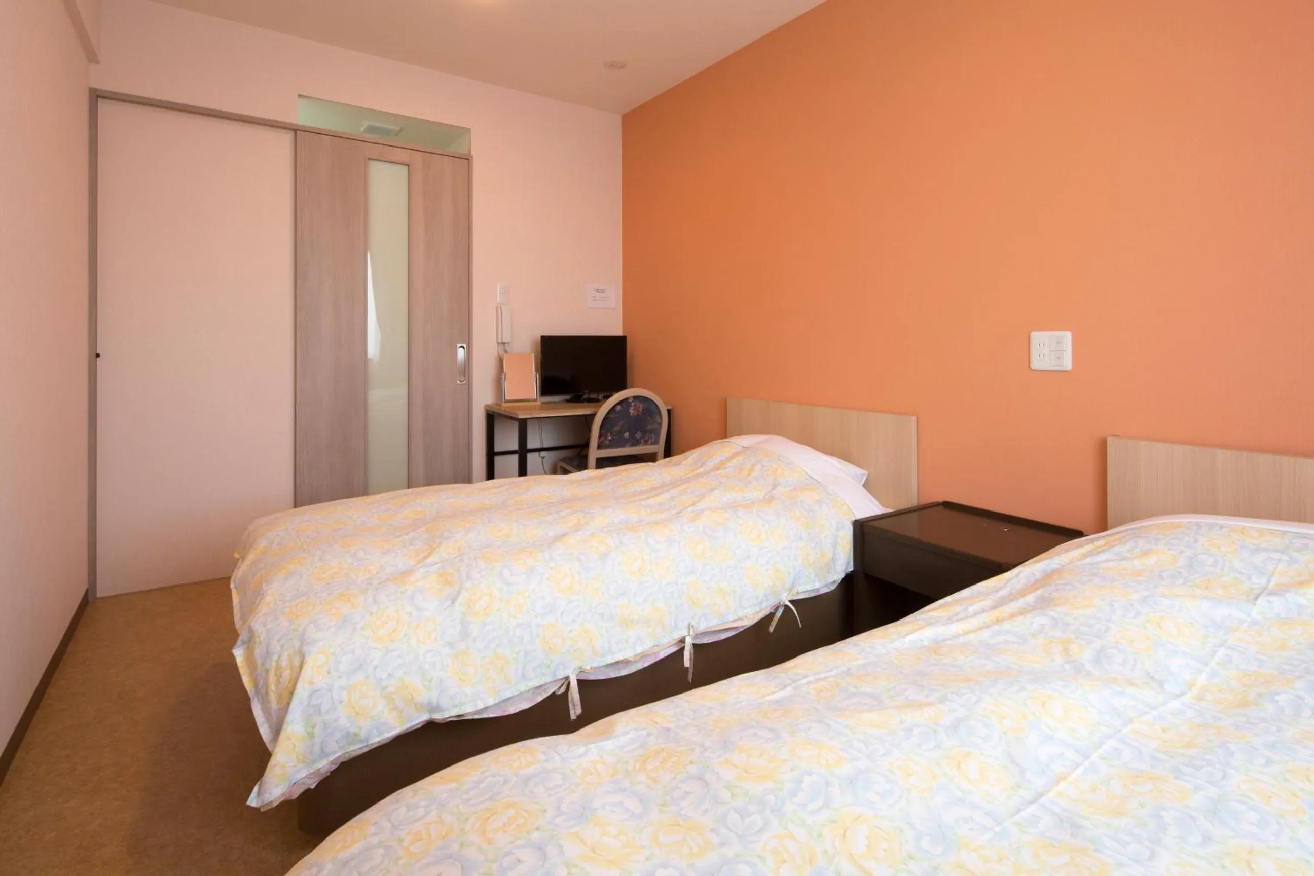 Bed in Hotel Asahi Grandeur Fuchu