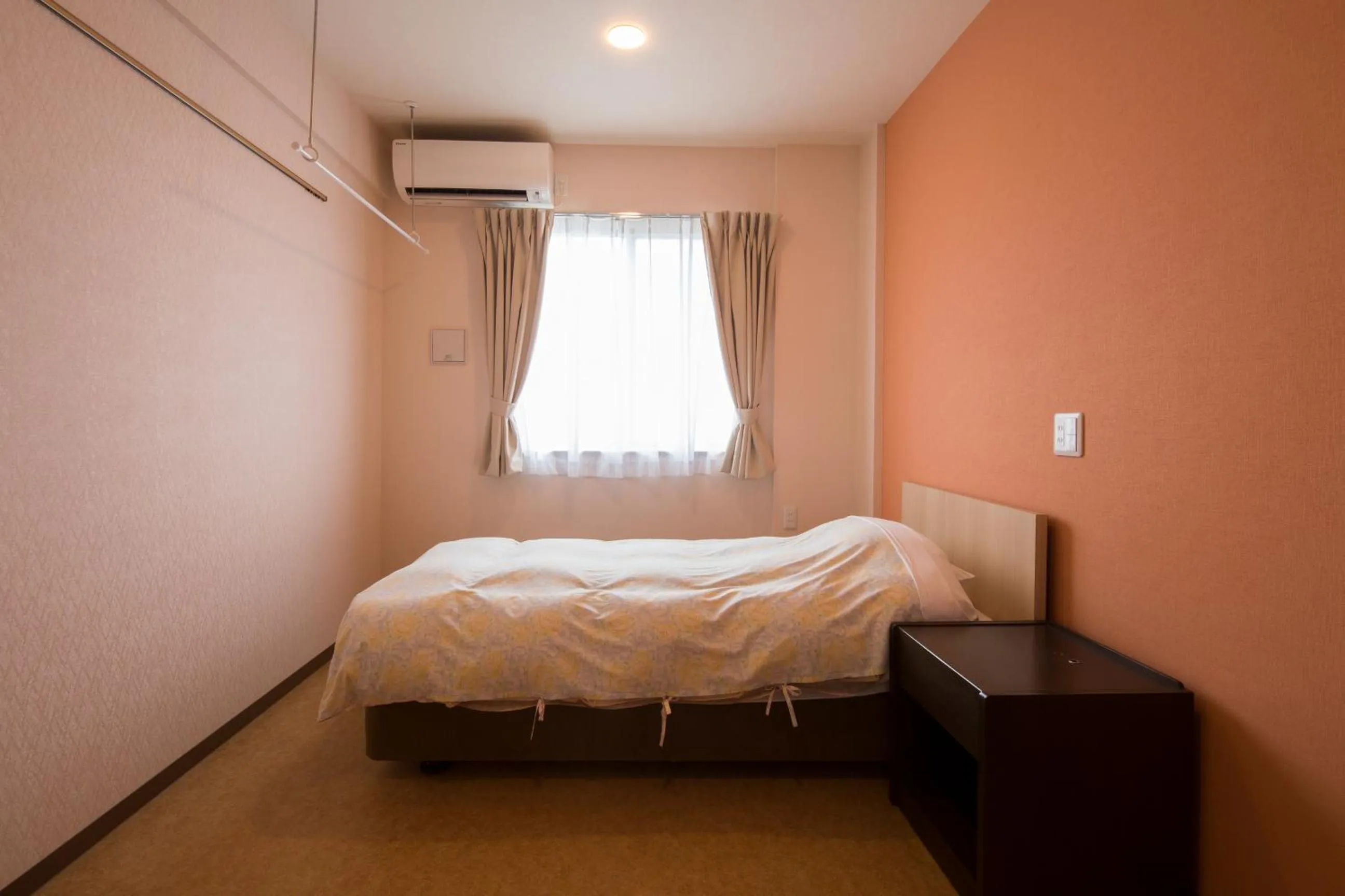 Bed in Hotel Asahi Grandeur Fuchu