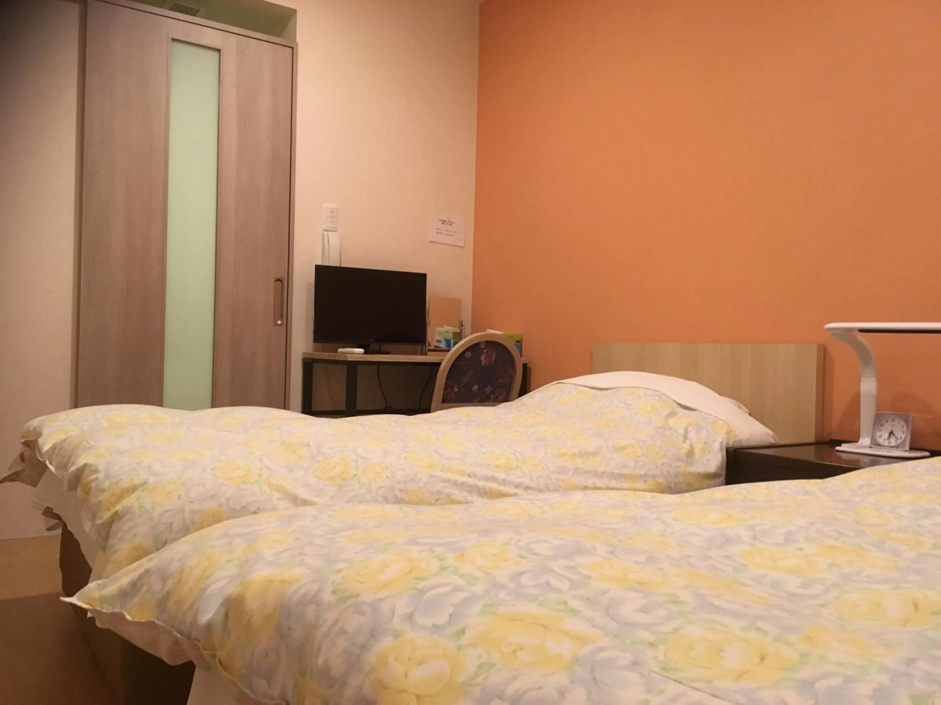 Bed in Hotel Asahi Grandeur Fuchu