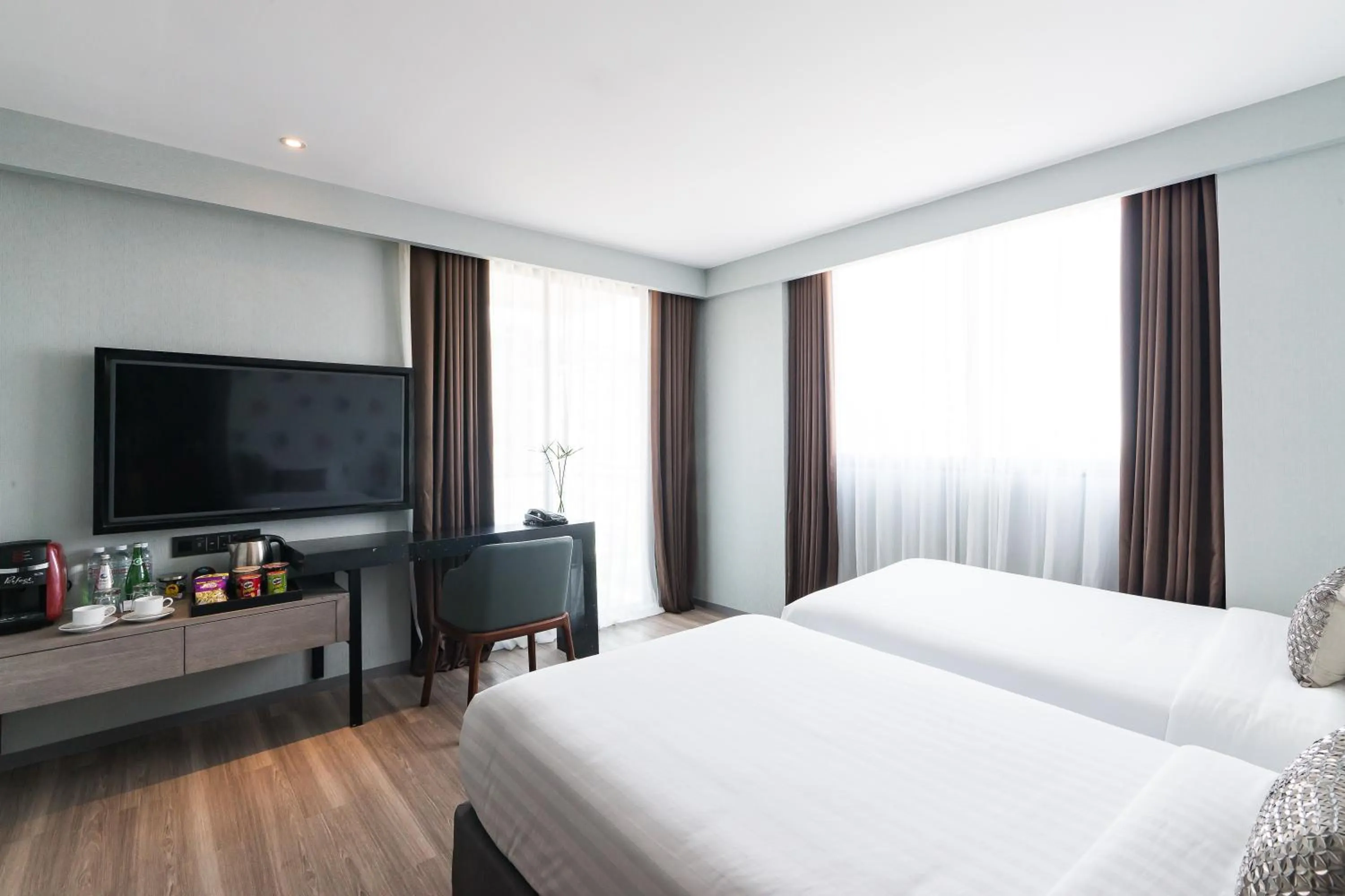 Communal lounge/ TV room, Bed in Citrus Grande Hotel Pattaya by Compass Hospitality