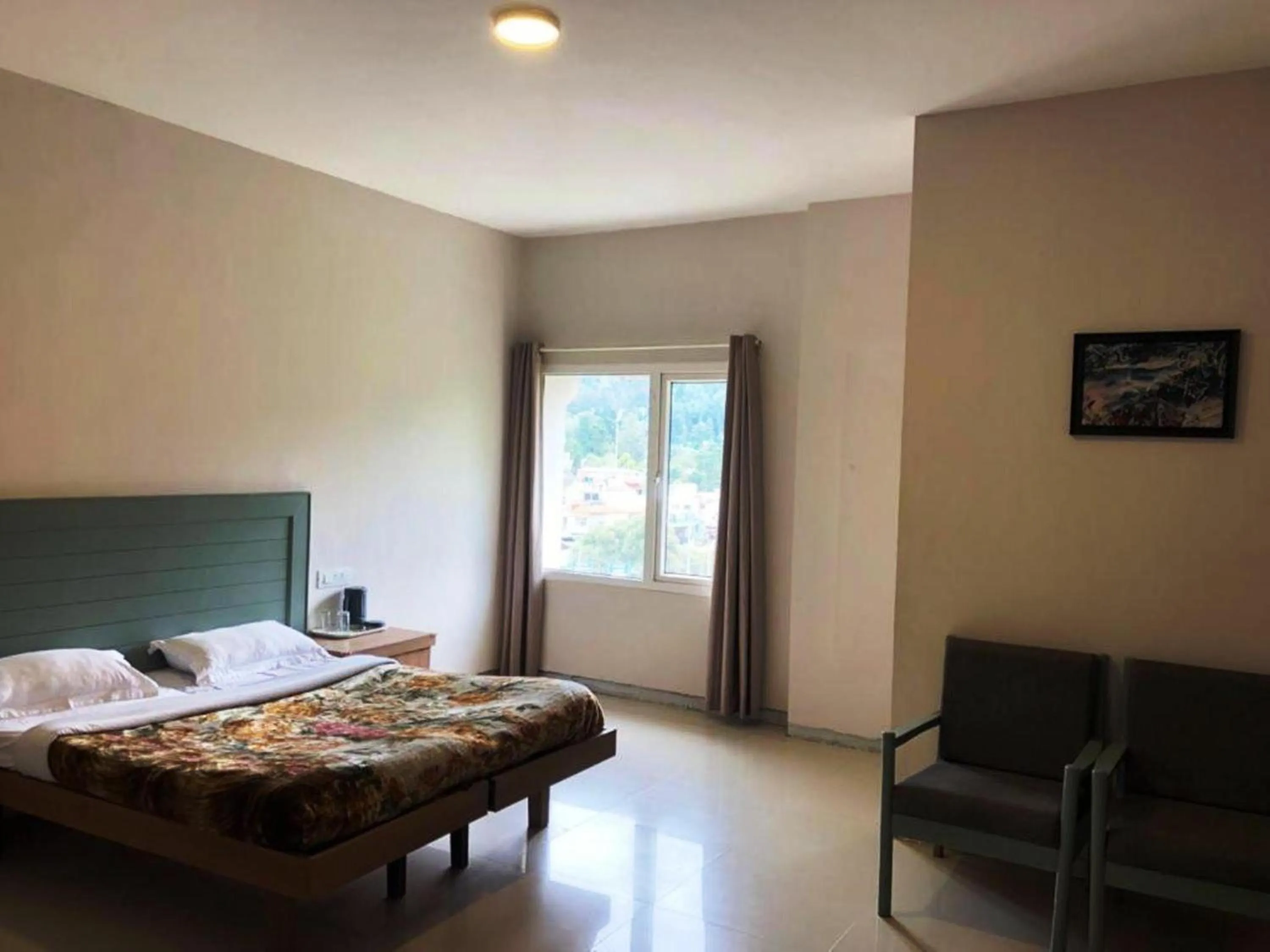 Bed in Hotel Preethi Palace