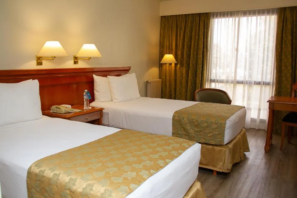 Bed in Austral Plaza Hotel