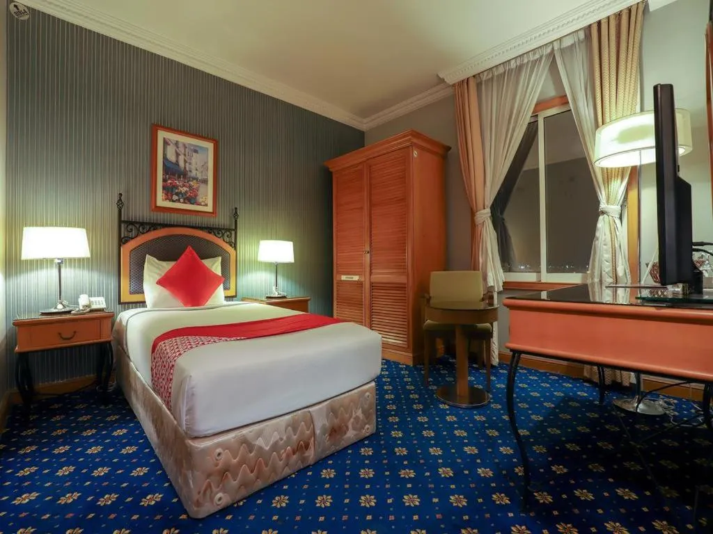 Bed in City Plaza Hotel