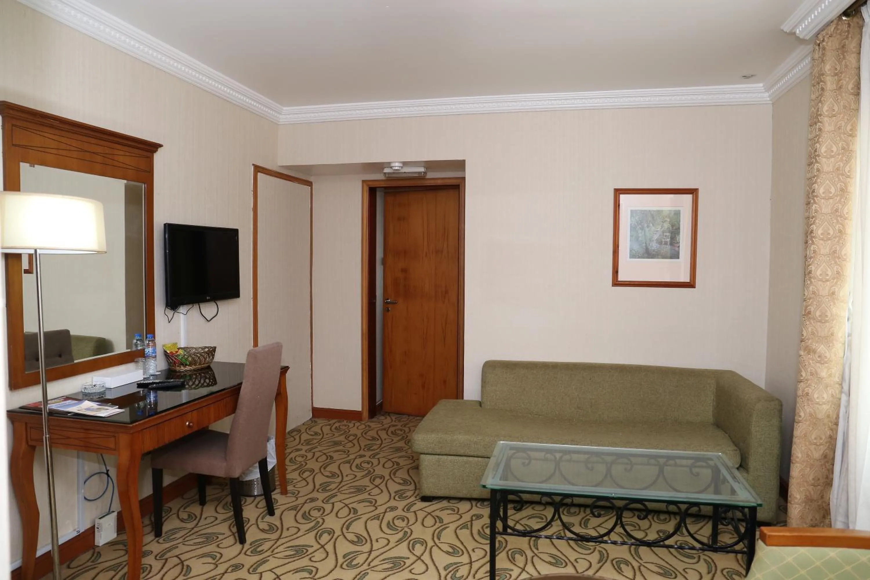 Living room in City Plaza Hotel