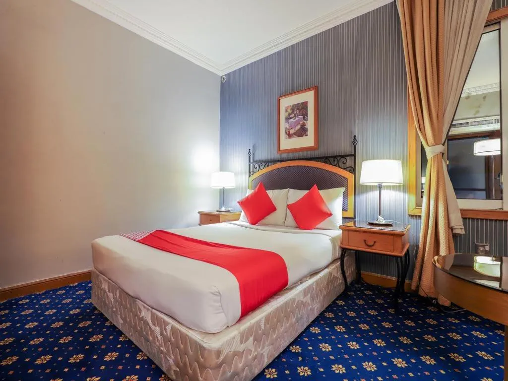 Bed in City Plaza Hotel