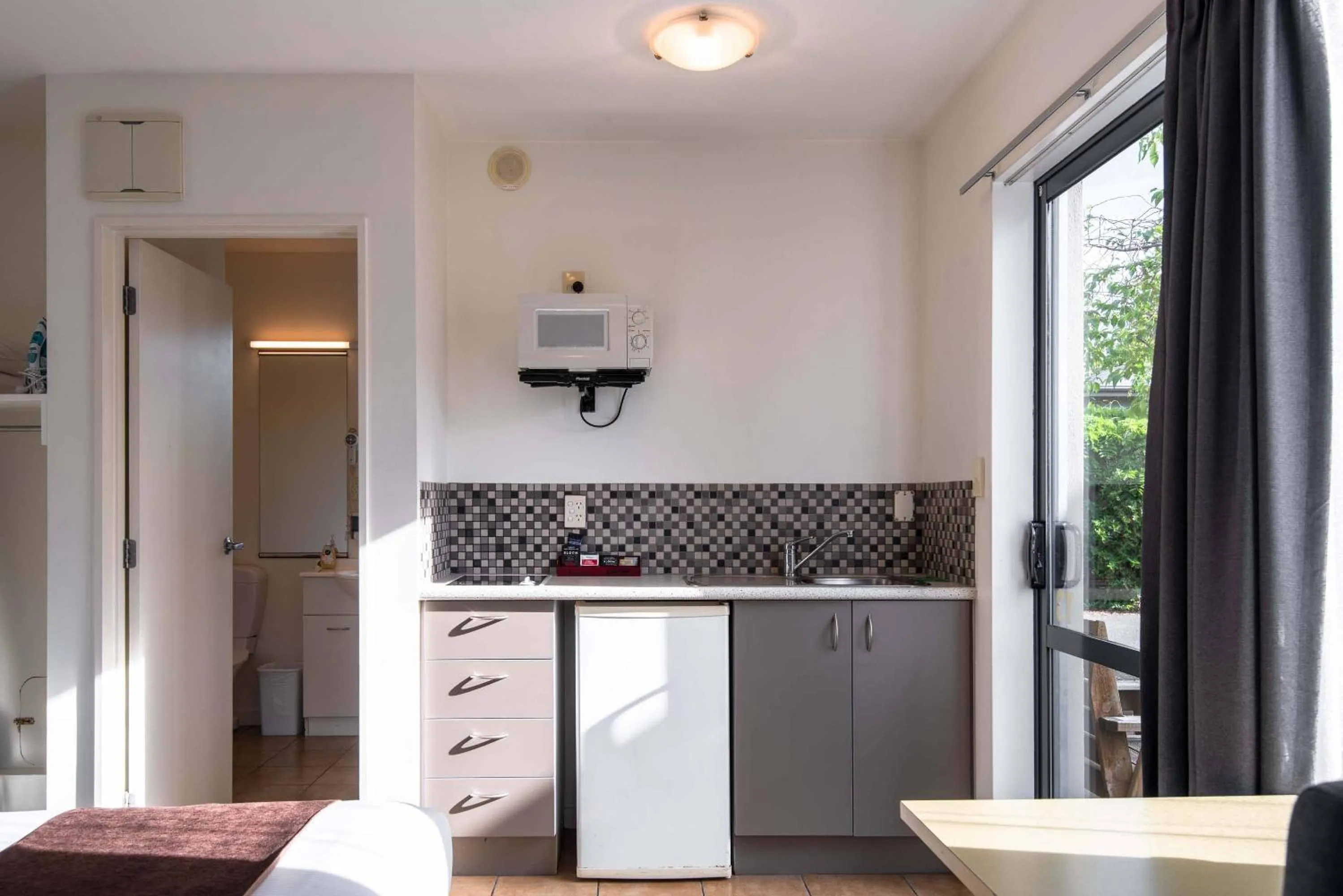 Bed in 298 Westside Motor Lodge