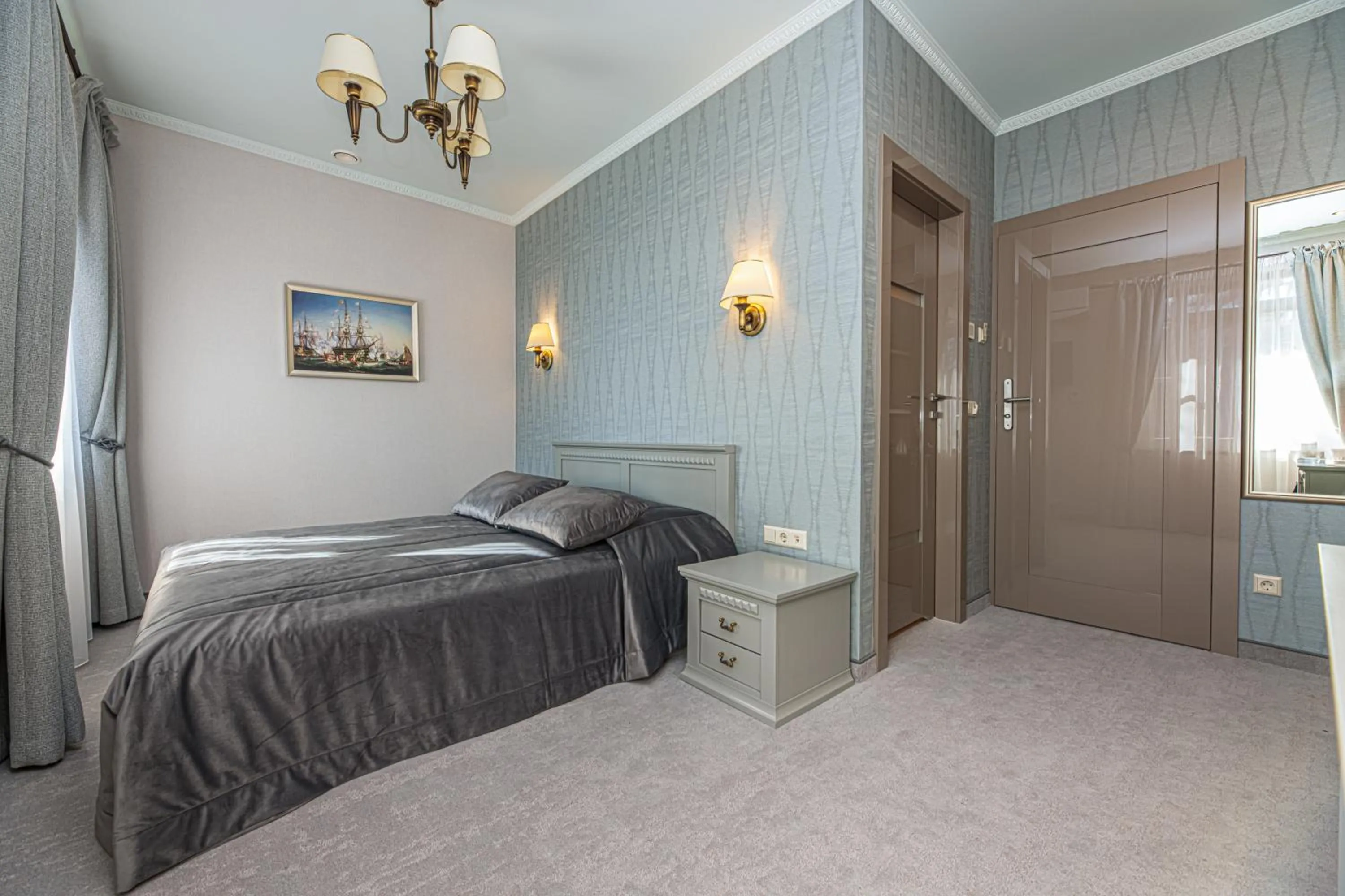 Bed in Senoji Hansa Hotel