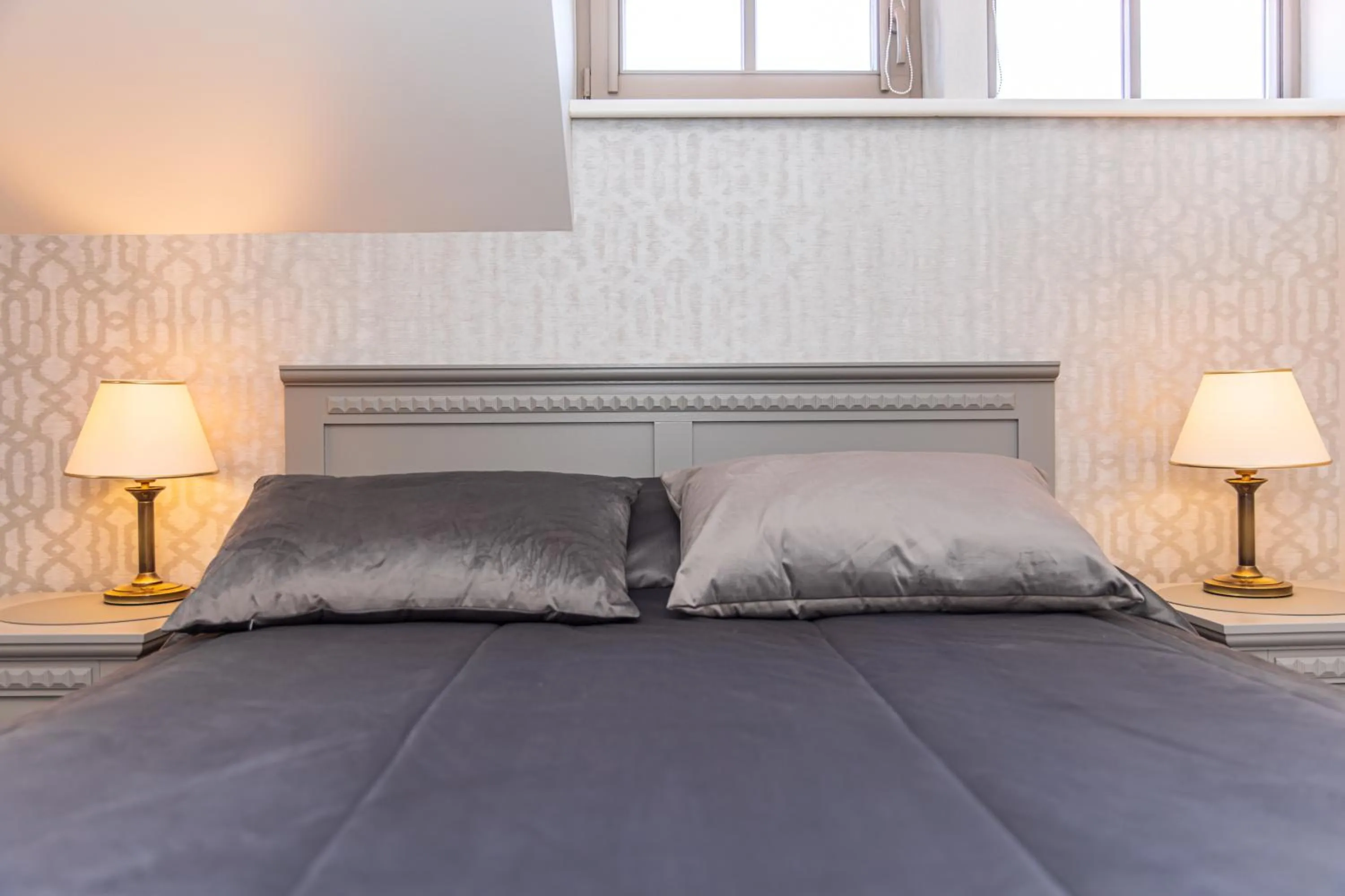 Bed in Senoji Hansa Hotel