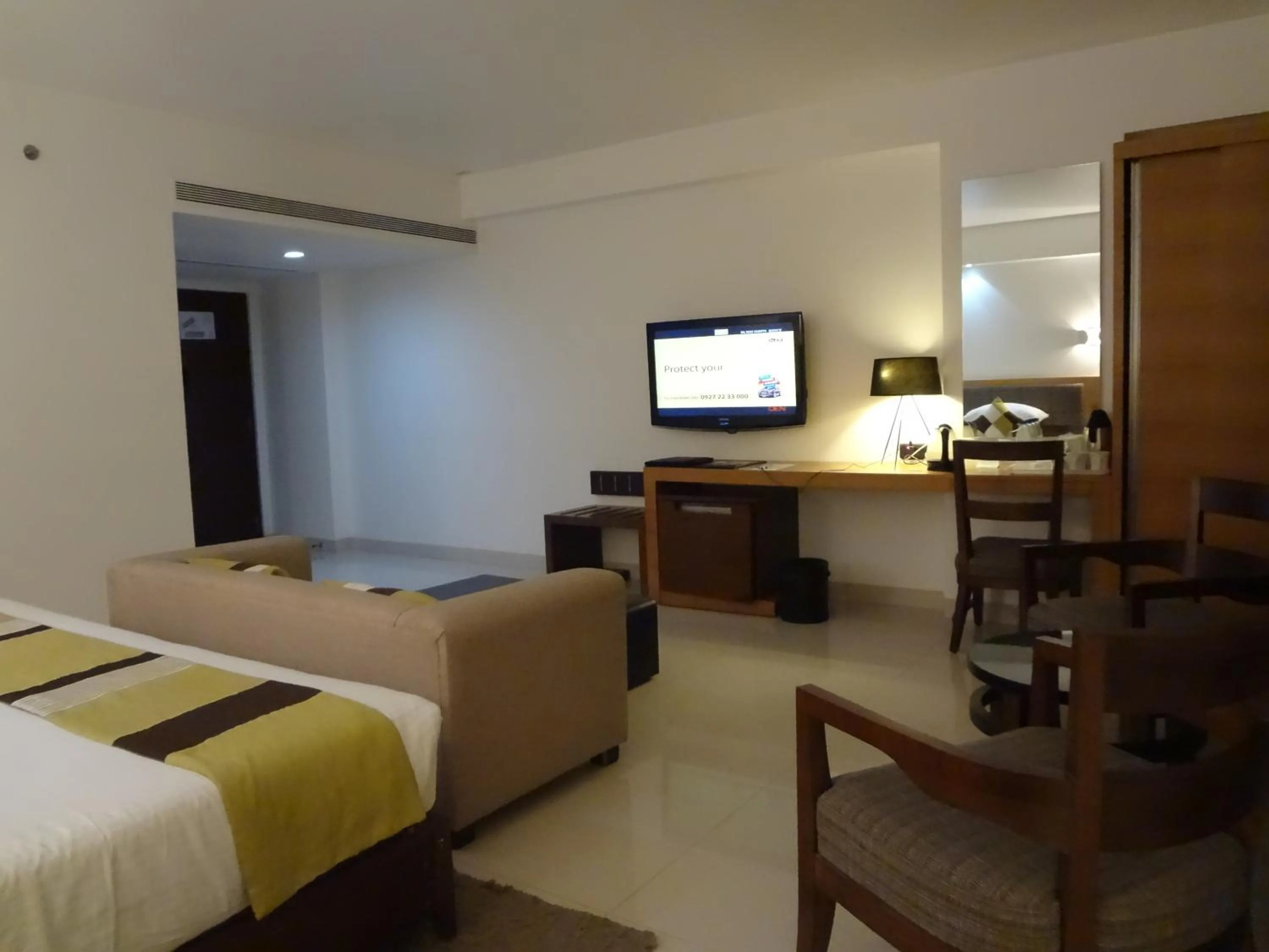 Seating area, Bed in Hotel Suba International Sahar Road Mumbai