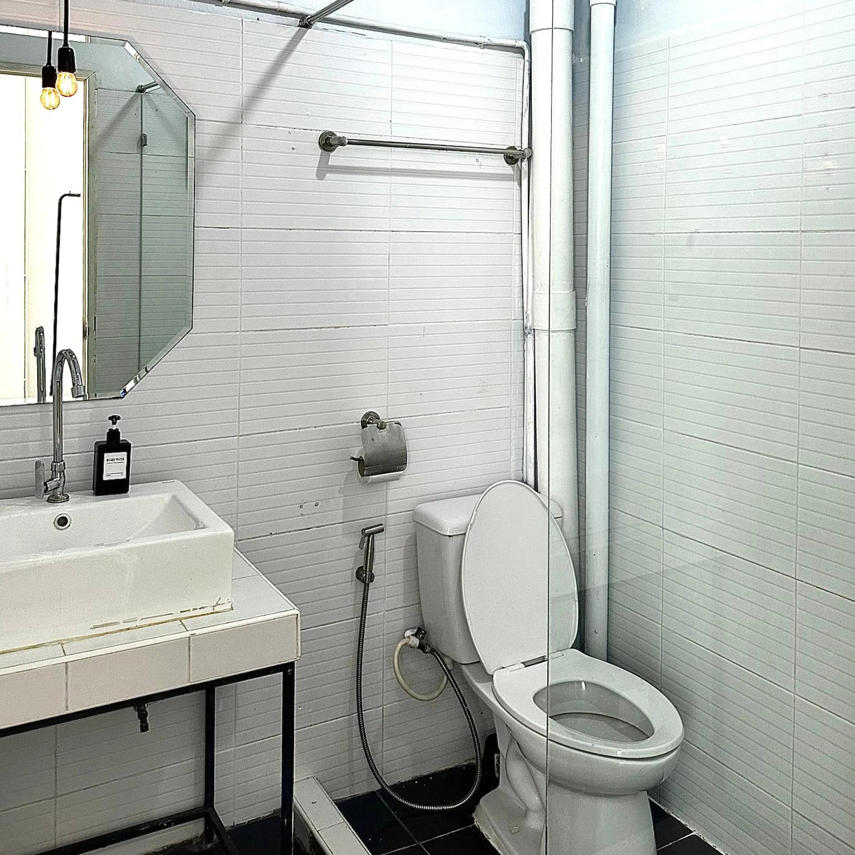 Toilet in Beige Poshtels + Netflix