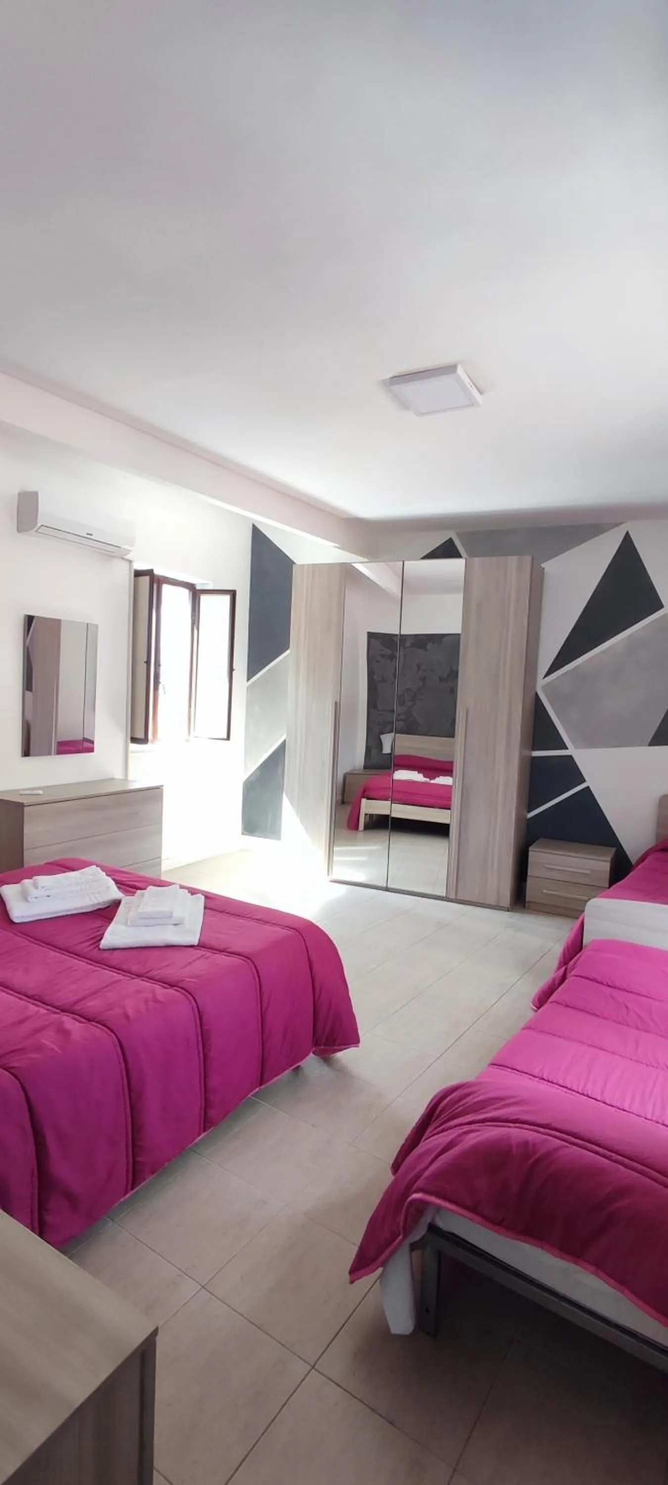 Bed in I Cappuccini Rooms