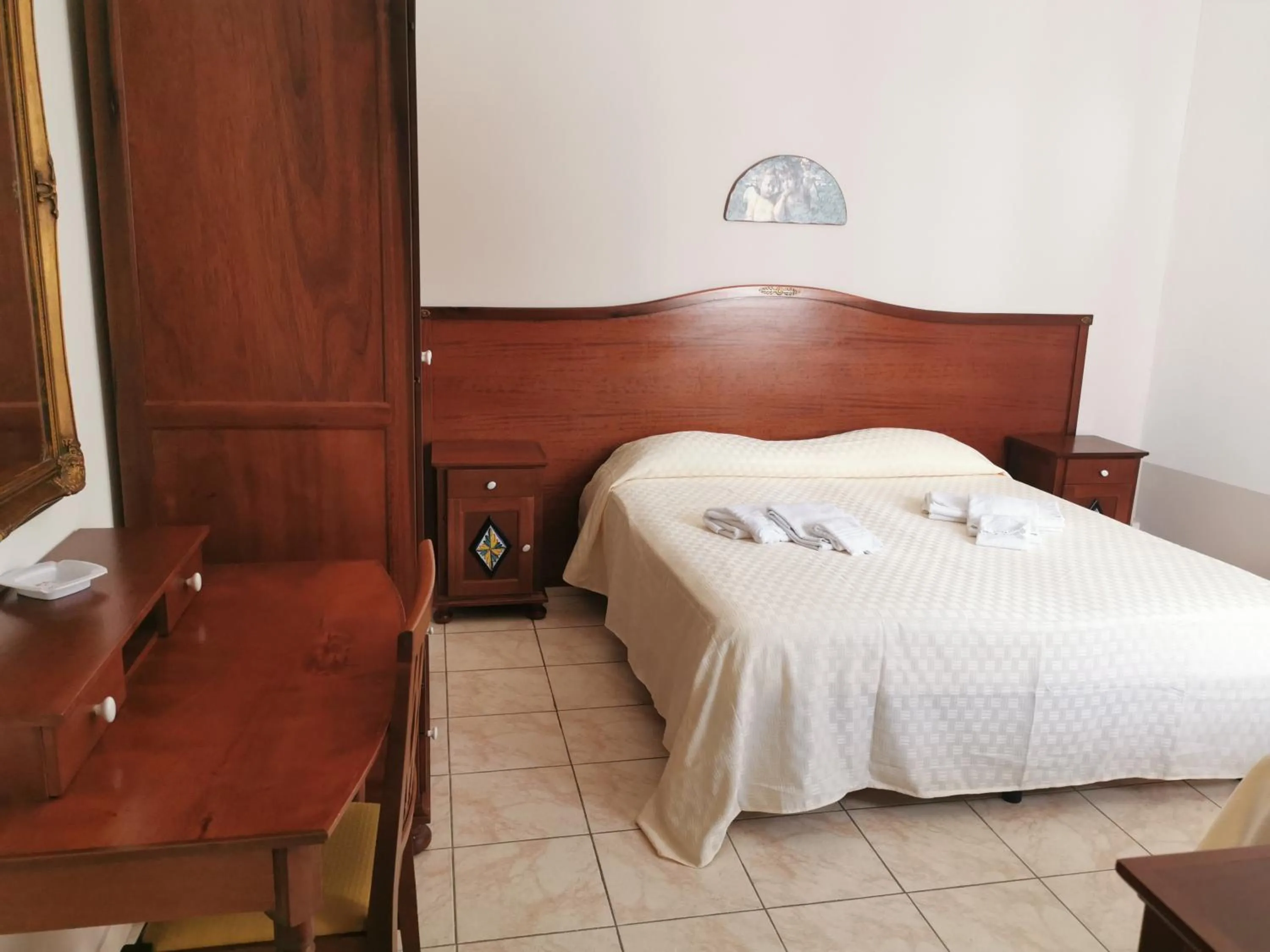 Bedroom in I Cappuccini Rooms