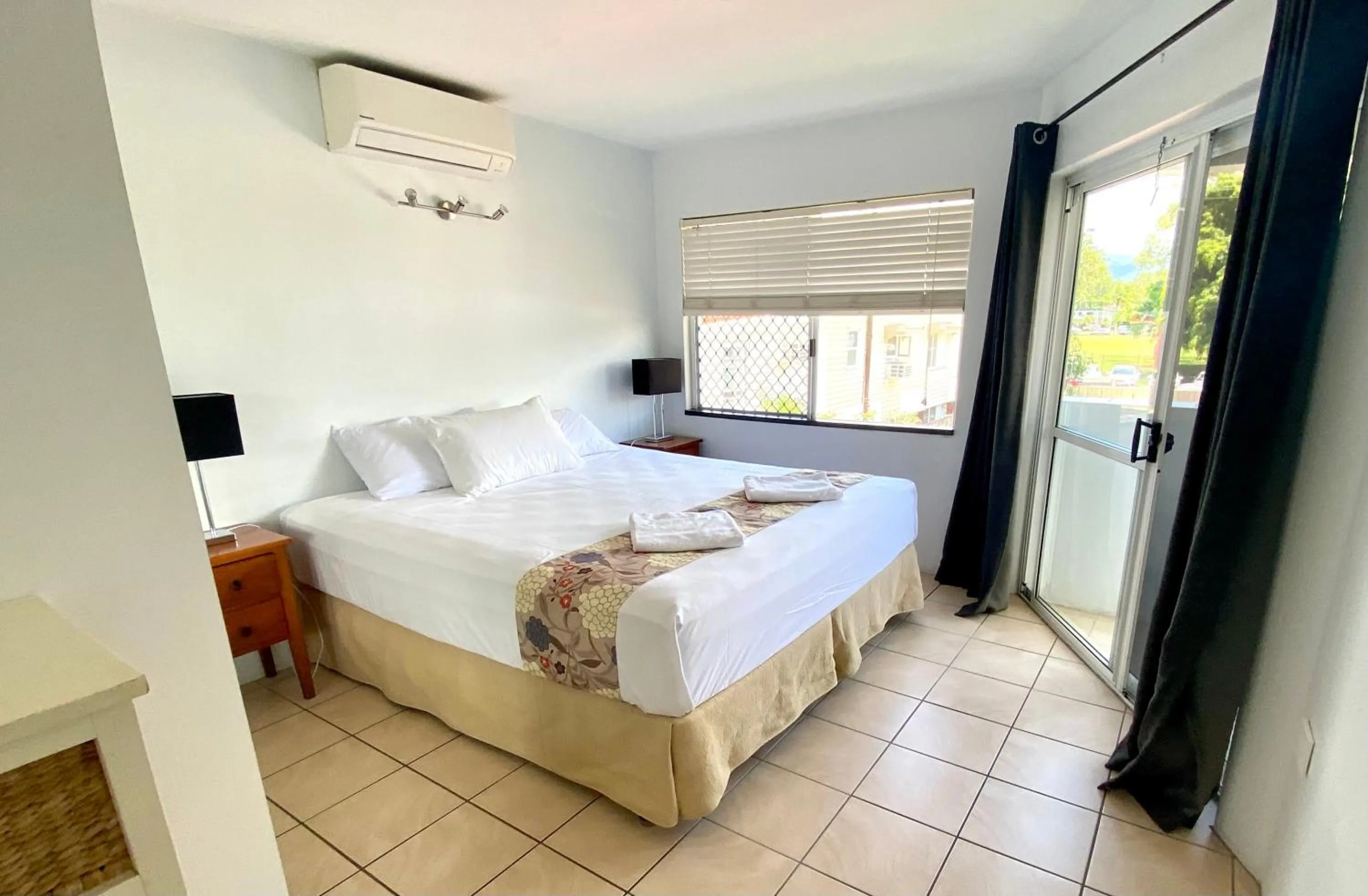 Bed in Reef Gateway Apartments