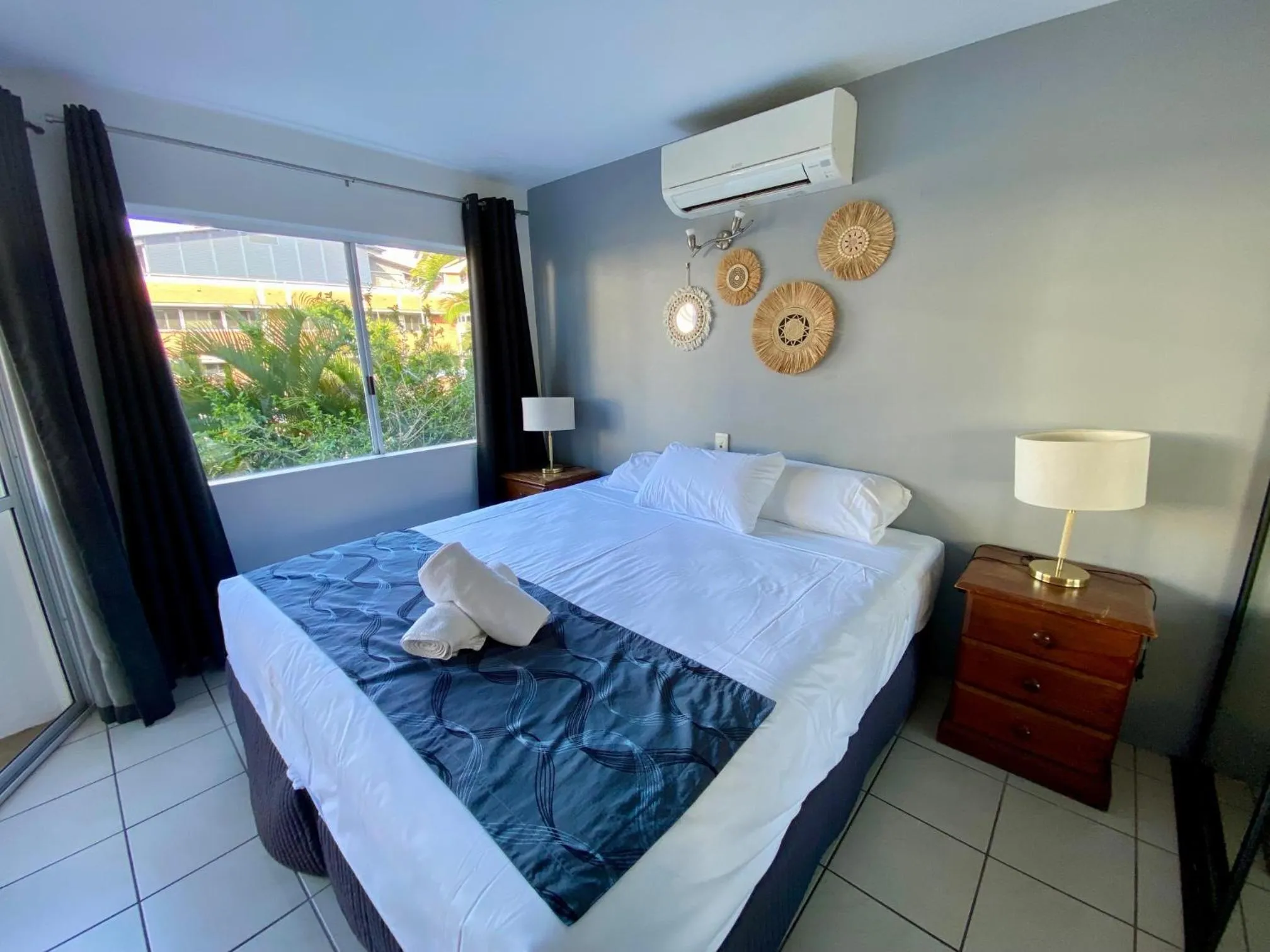Bed in Reef Gateway Apartments