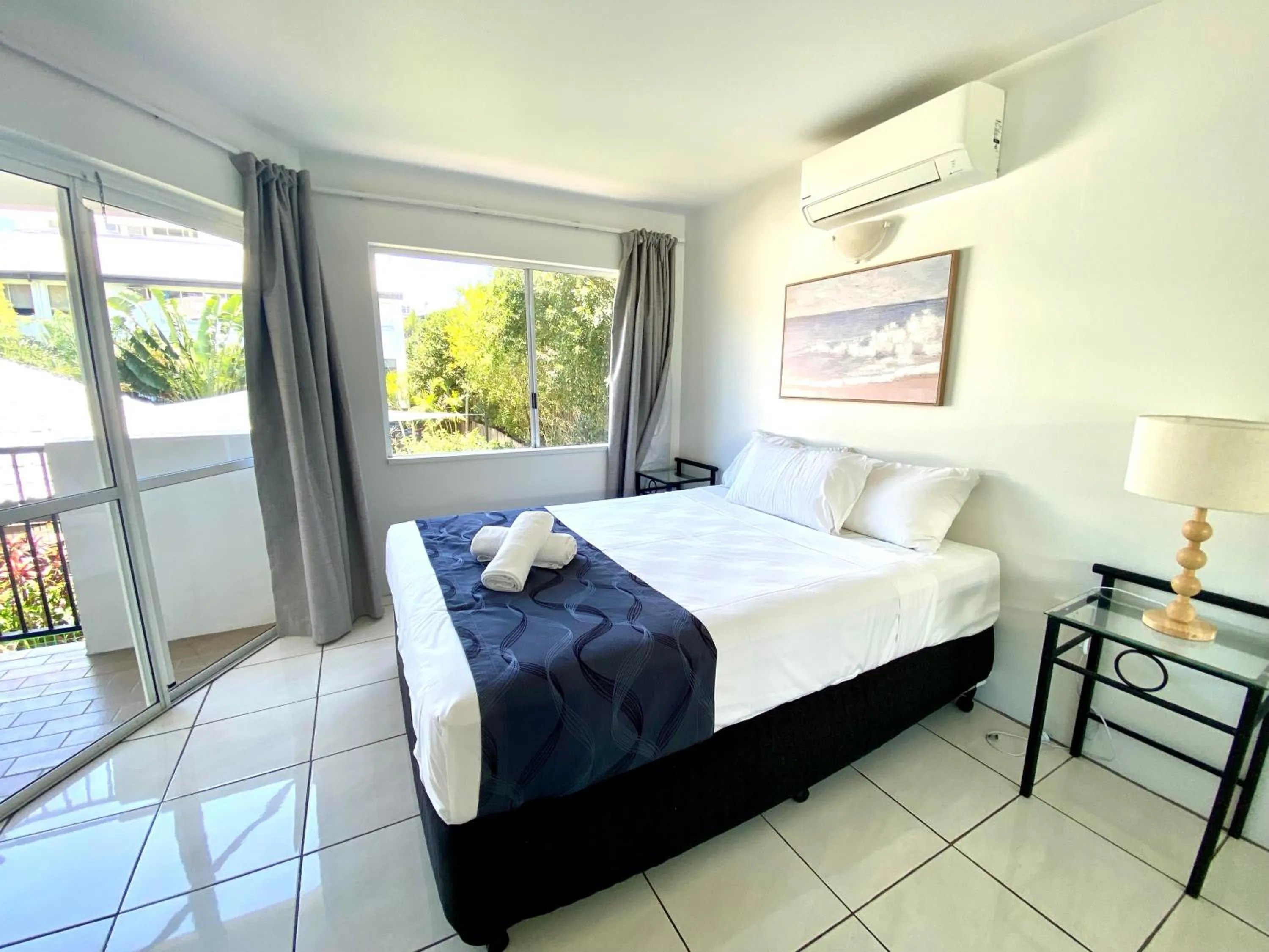 Bed in Reef Gateway Apartments