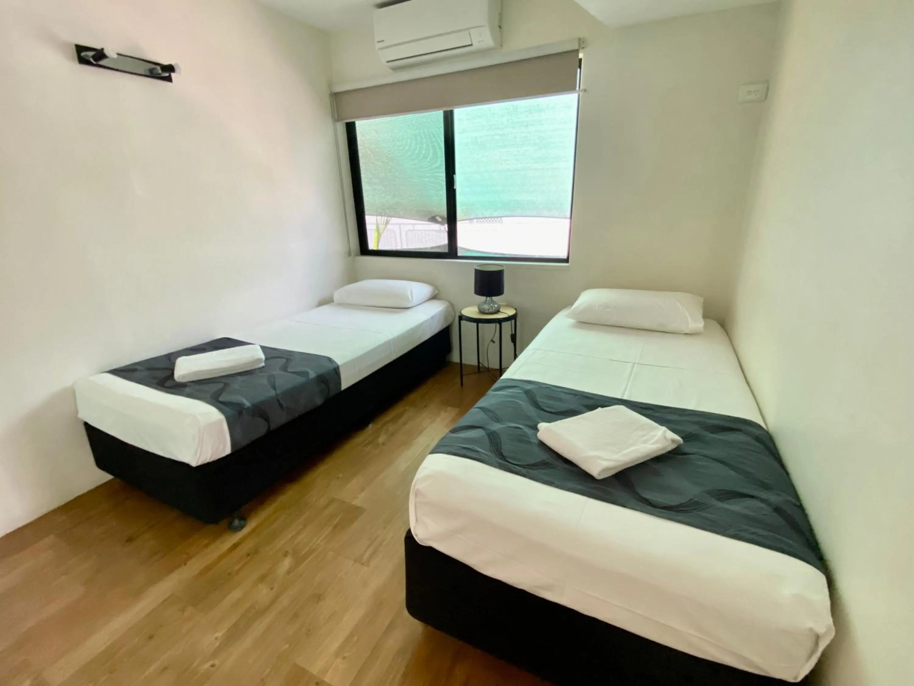 Bed in Reef Gateway Apartments