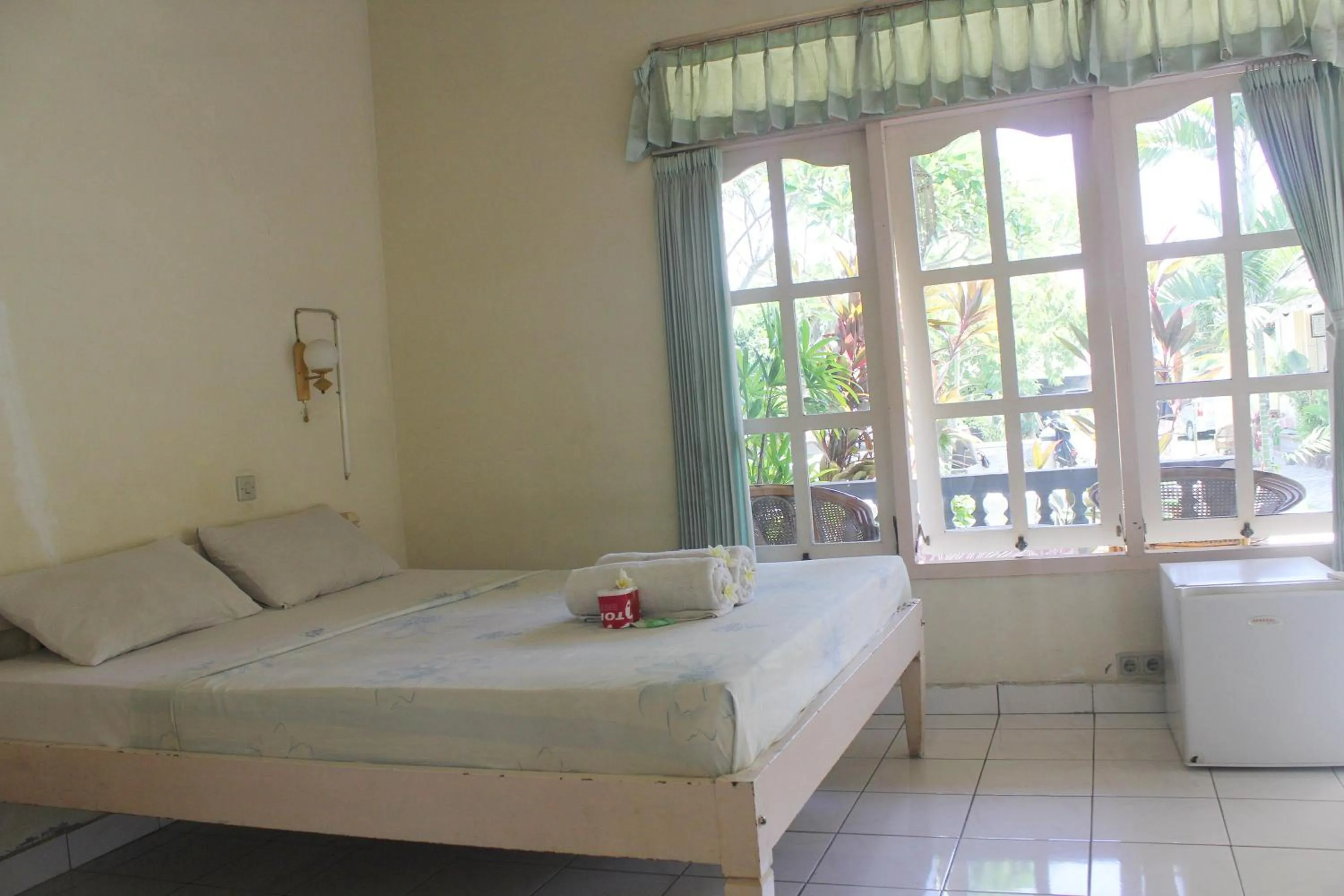 Bed in Taman Lily's Hotel