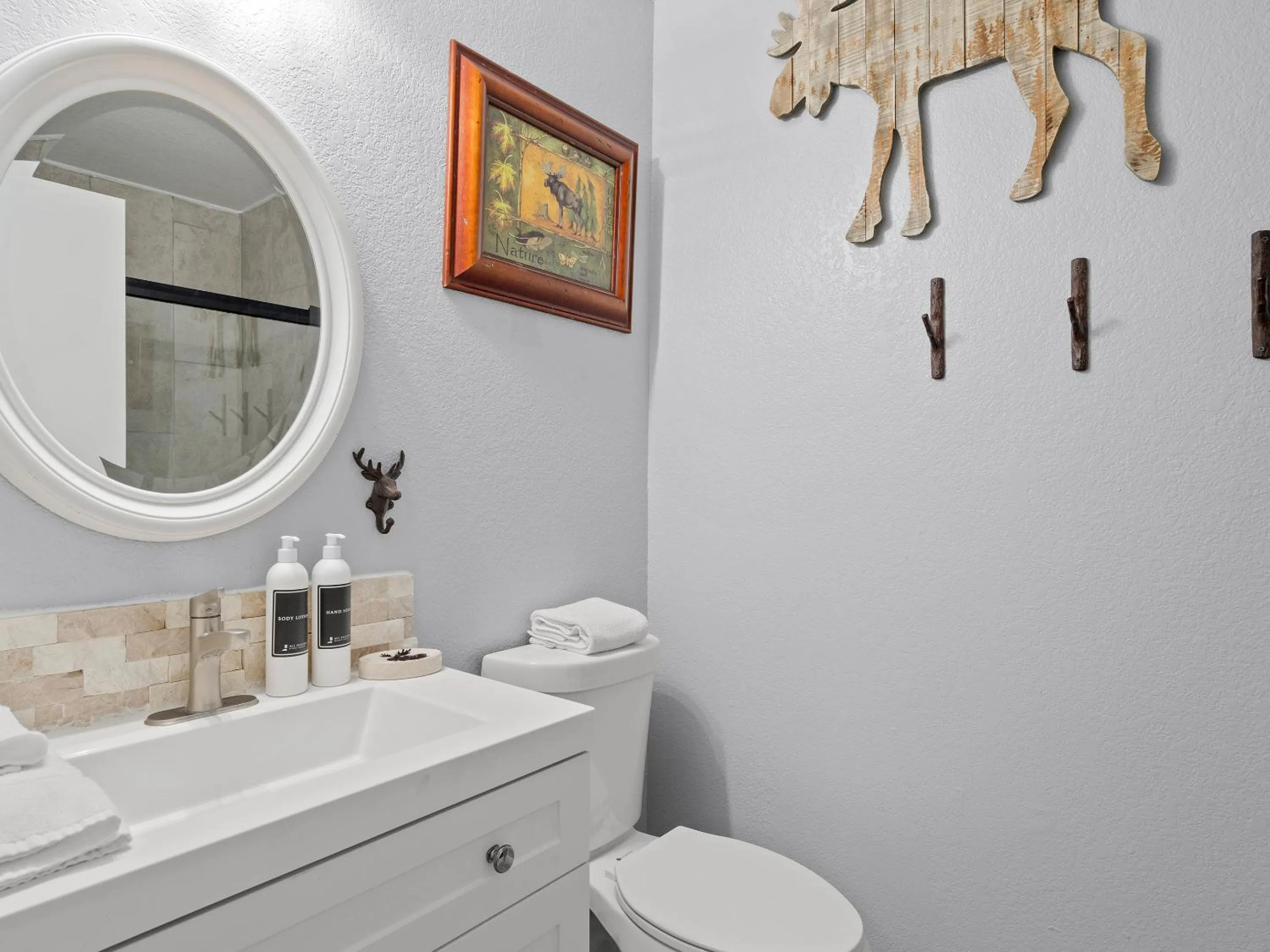 Bathroom in Carriage House Condominiums by All Seasons Resort Lodging