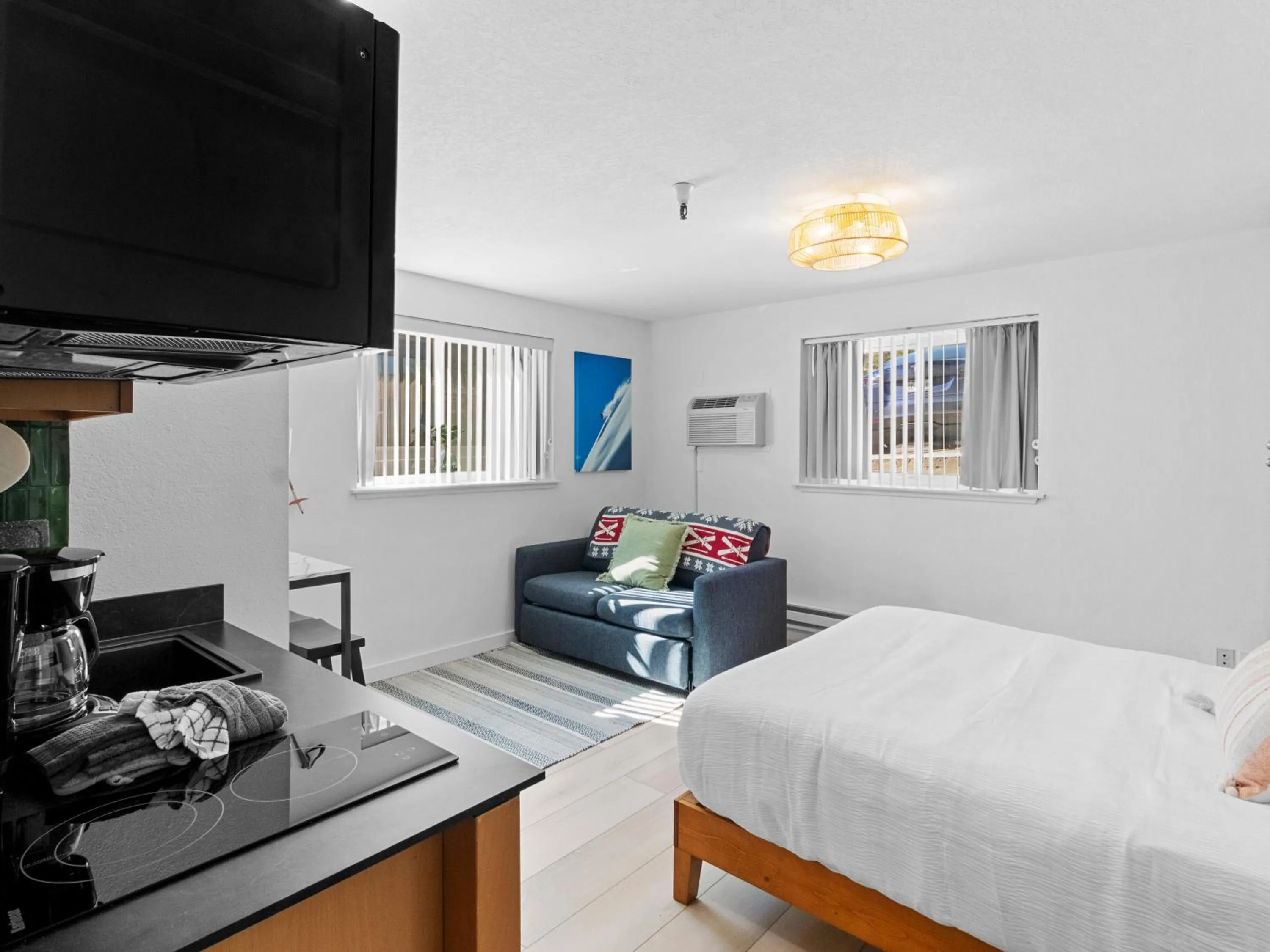 Living room, Bed in Carriage House Condominiums by All Seasons Resort Lodging