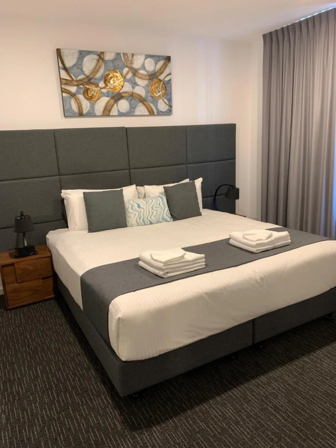 Bed in The Palms Apartments