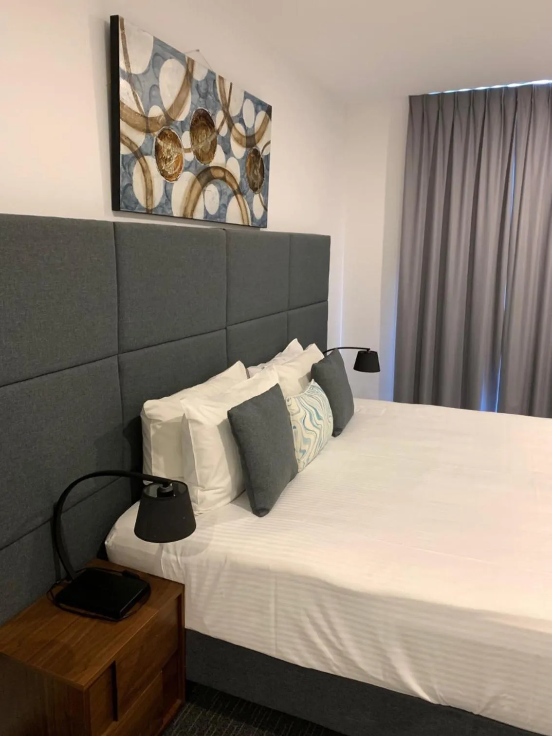 Bed in The Palms Apartments