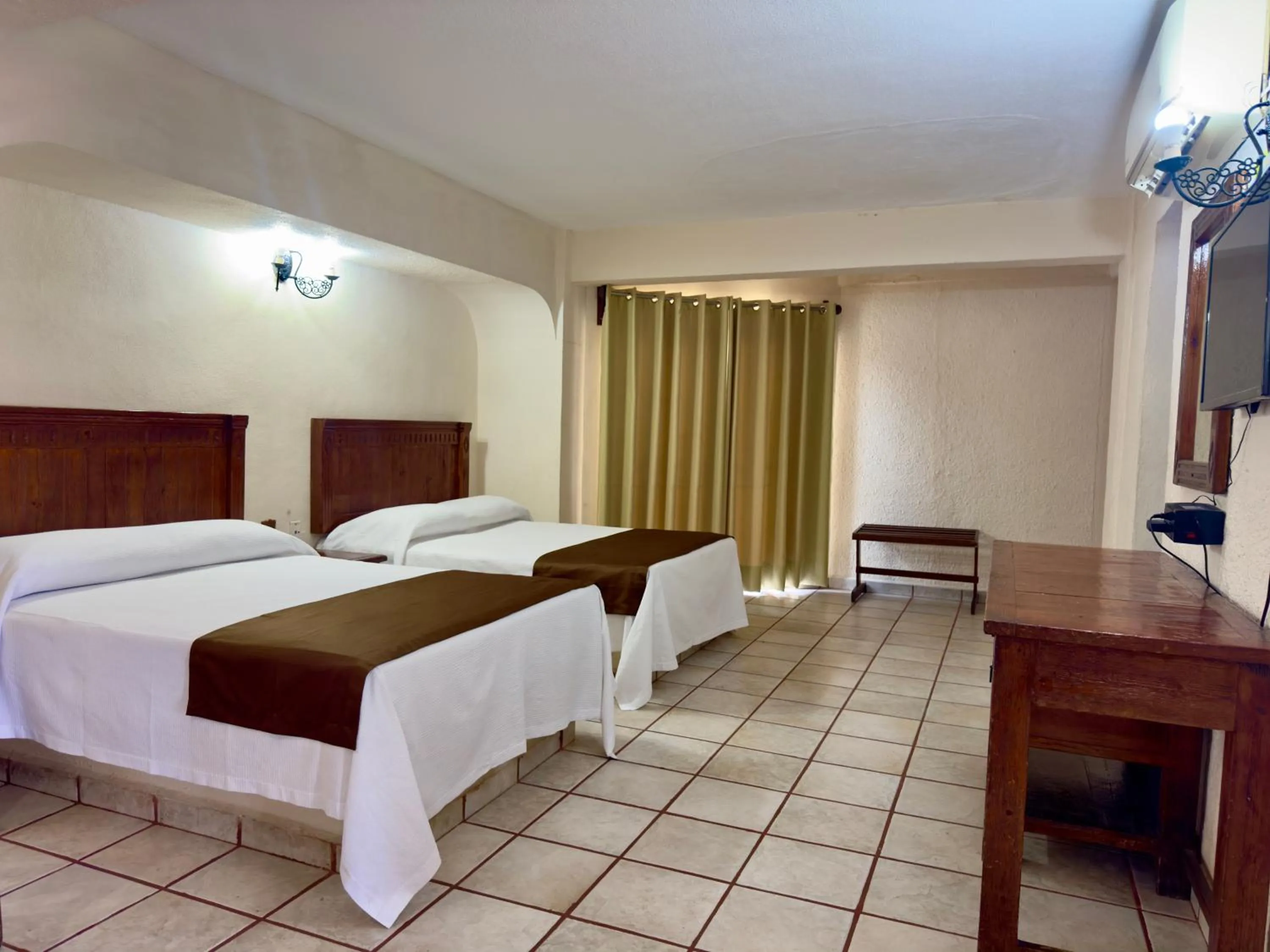 Bed in Hotel Hacienda María Eugenia Acapulco